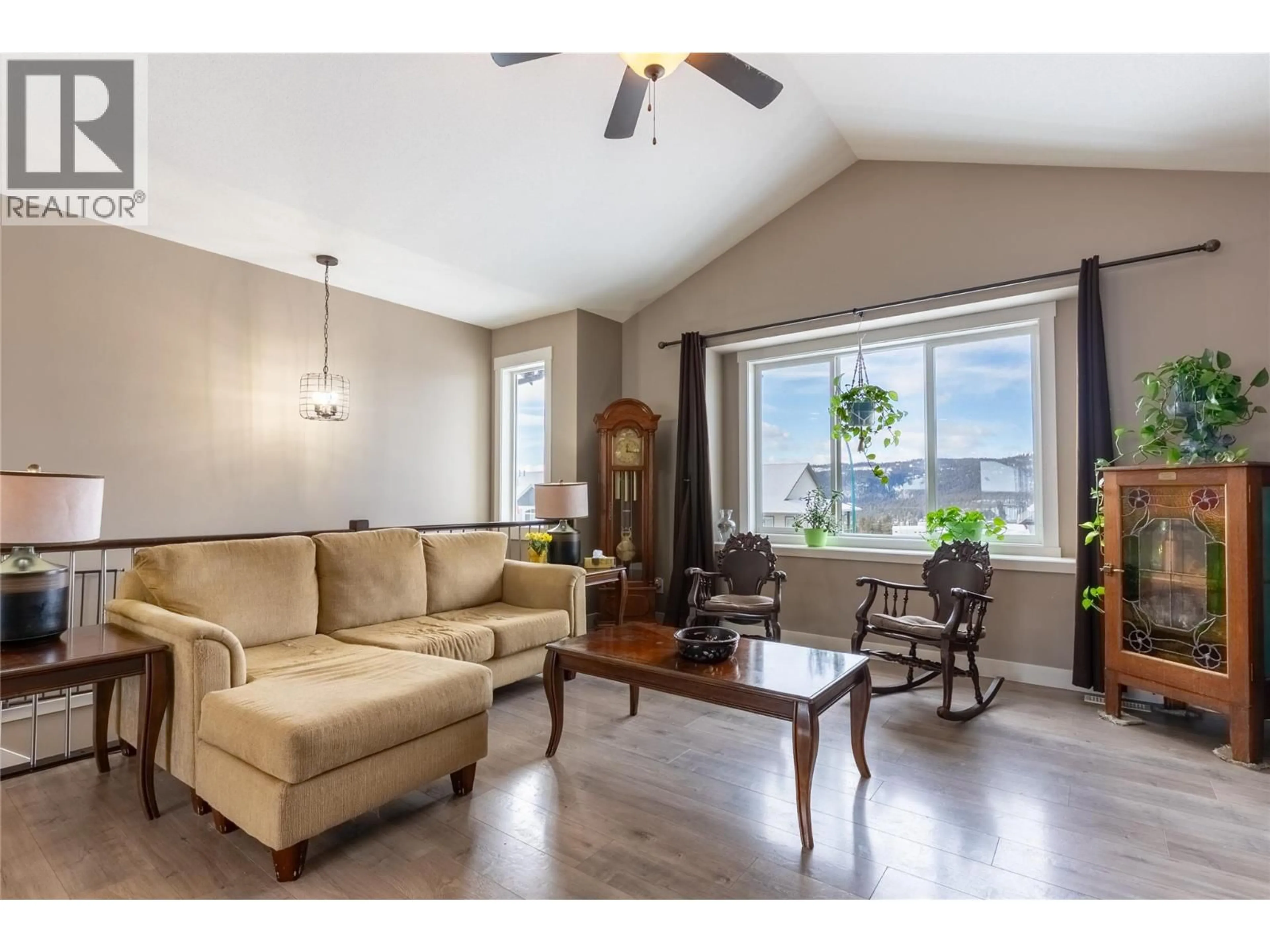 Living room with furniture, wood/laminate floor for 425 ARALIA PLACE, Logan Lake British Columbia V0K1W0