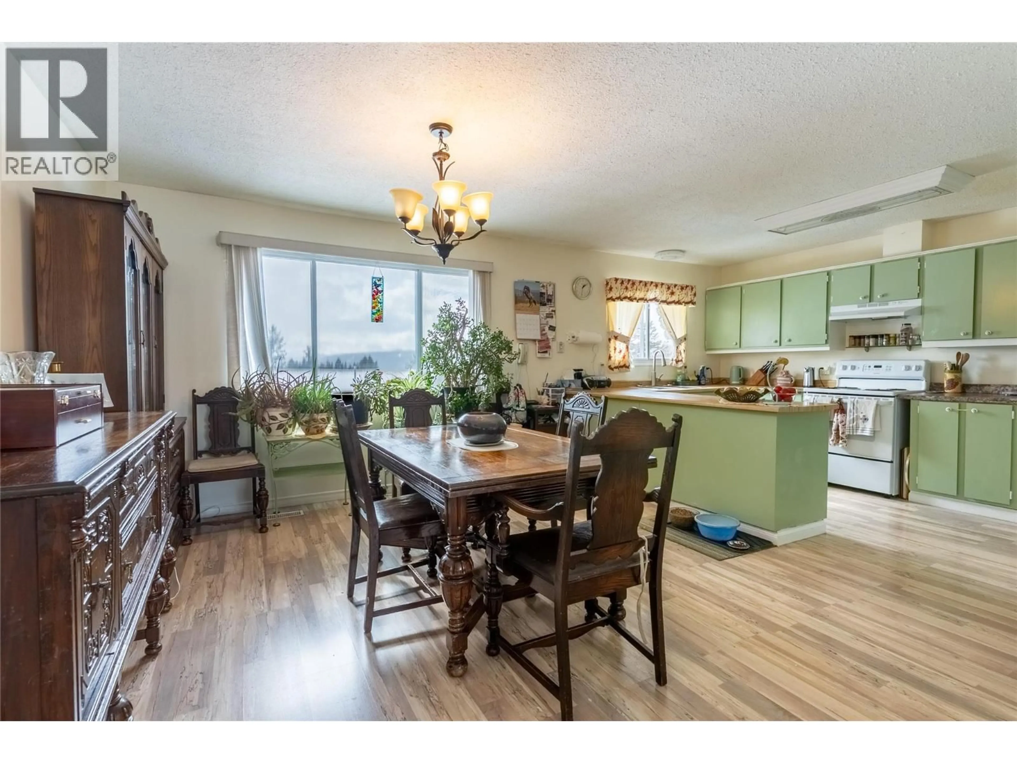 Open concept kitchen, wood/laminate floor for 52 BRECCIA DRIVE, Logan Lake British Columbia V0K1W0