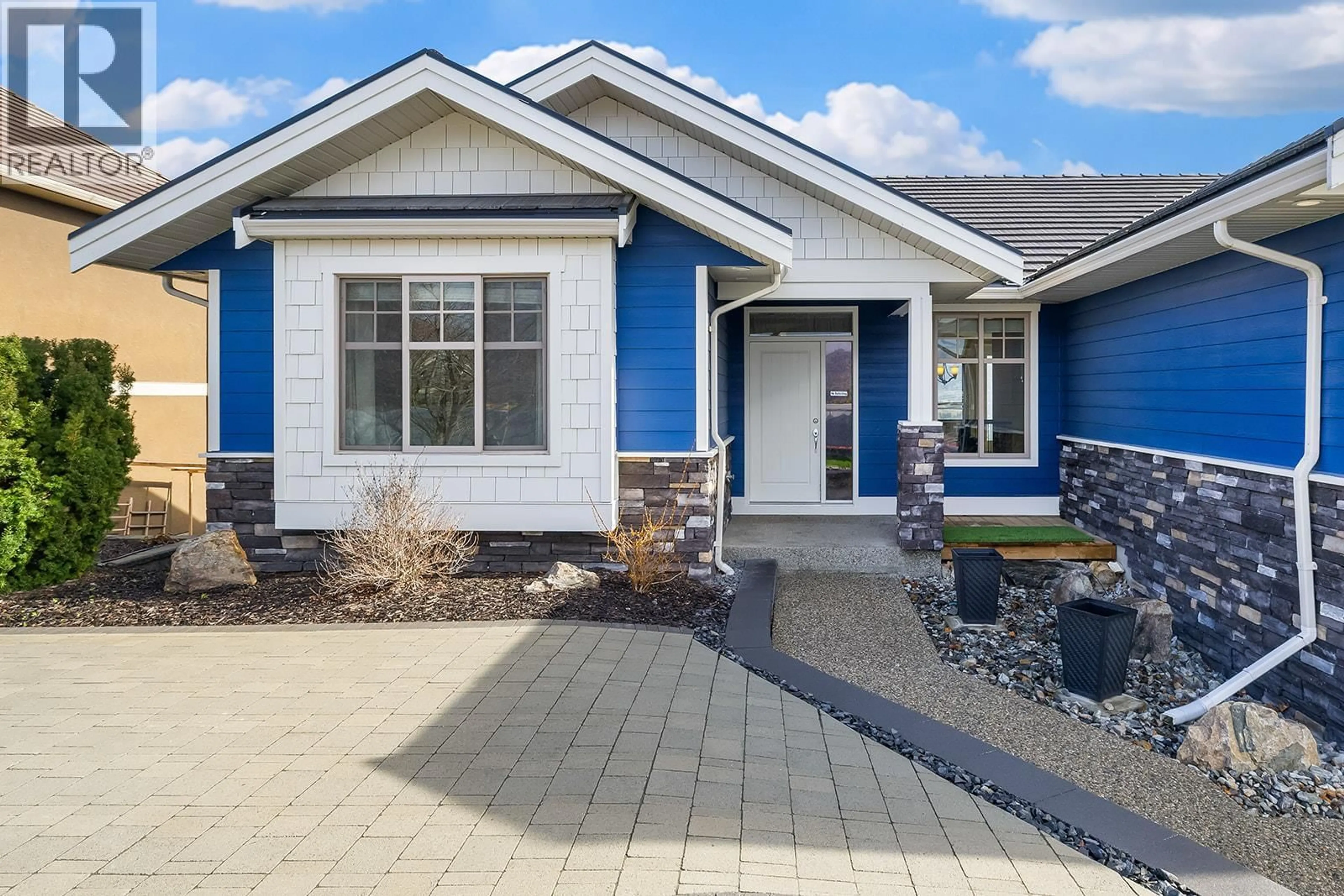 Home with vinyl exterior material, street for 1767 CAPISTRANO PEAKS CRESCENT, Kelowna British Columbia V1V2N1