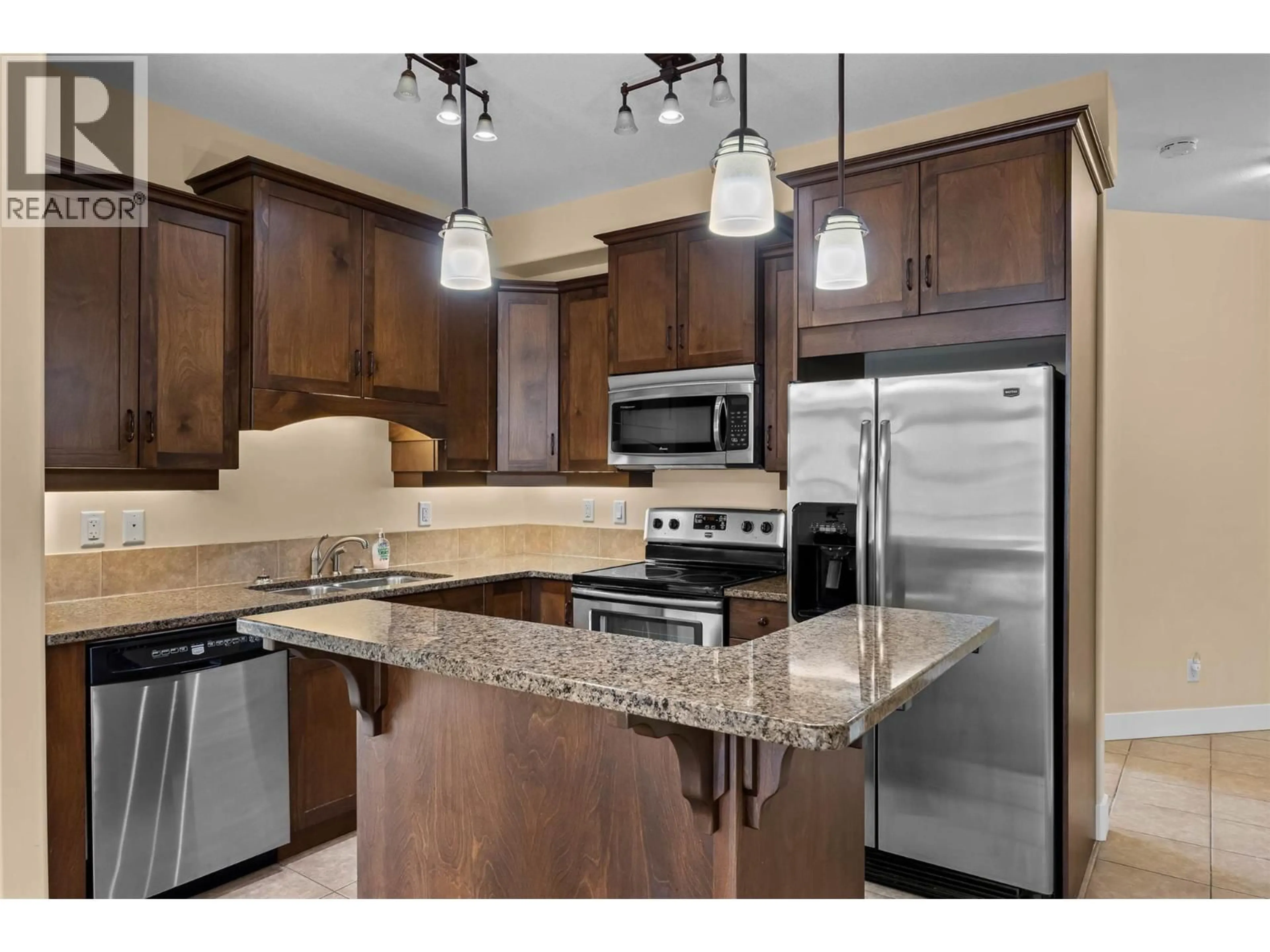 Open concept kitchen, ceramic/tile floor for 408 - 775 MCGILL ROAD, Kamloops British Columbia V2C0B8