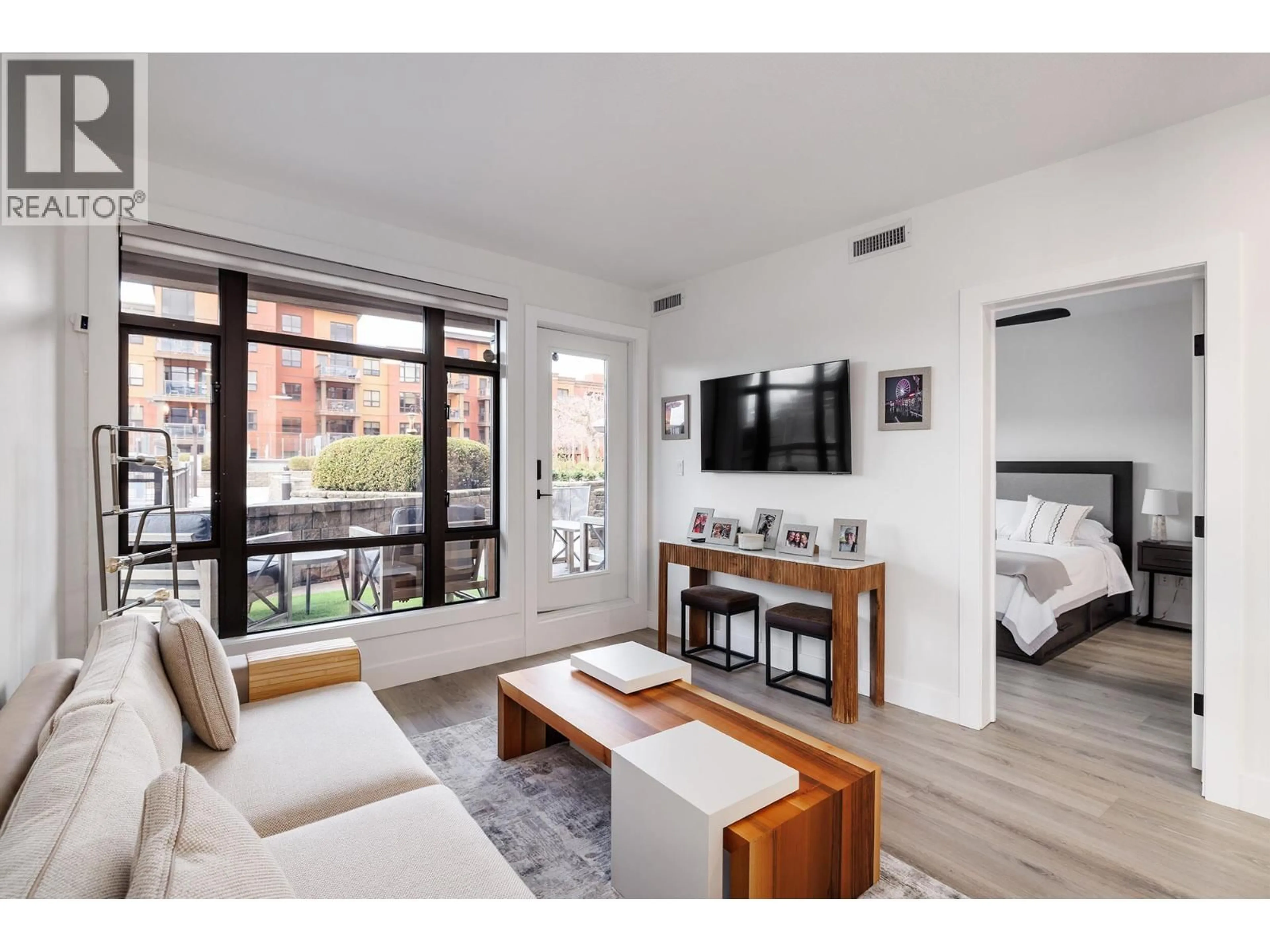 Living room with furniture, wood/laminate floor for 343 - 654 COOK ROAD, Kelowna British Columbia V1W3G7