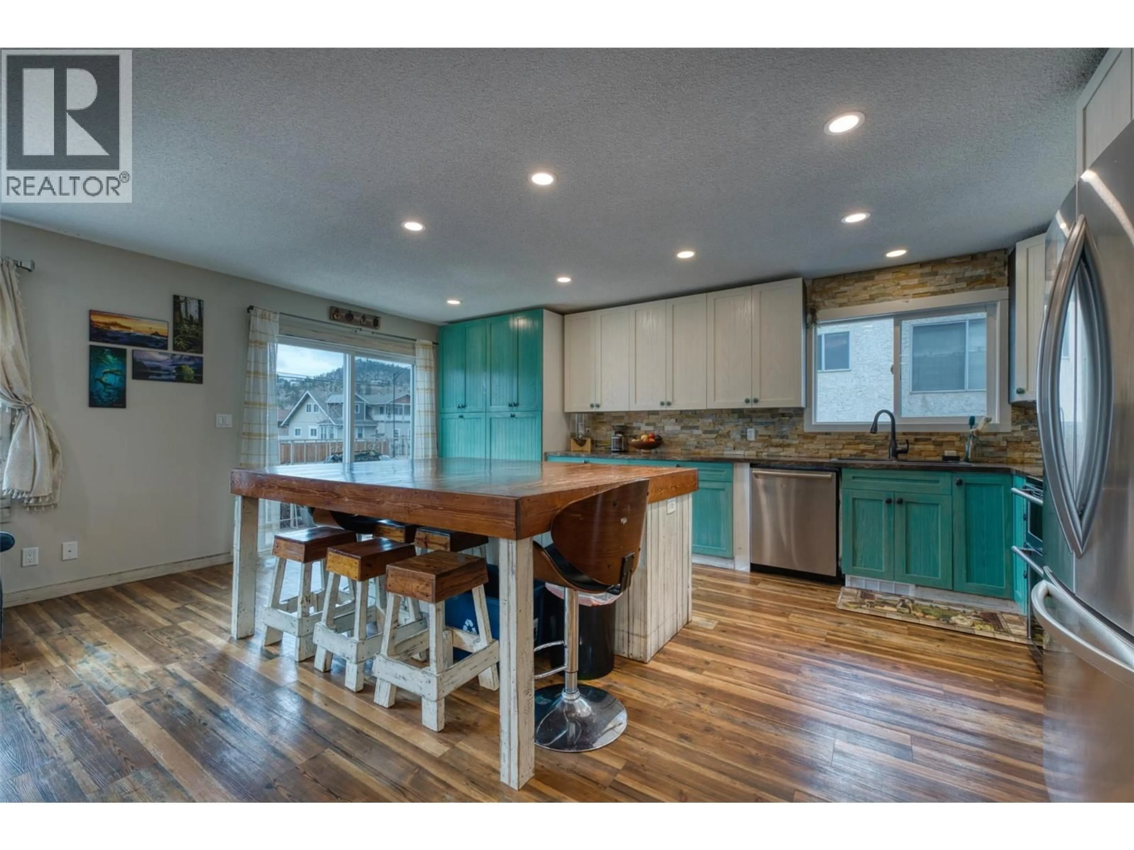 Open concept kitchen, wood/laminate floor for 397 LESTER ROAD, Kelowna British Columbia V1X4E8