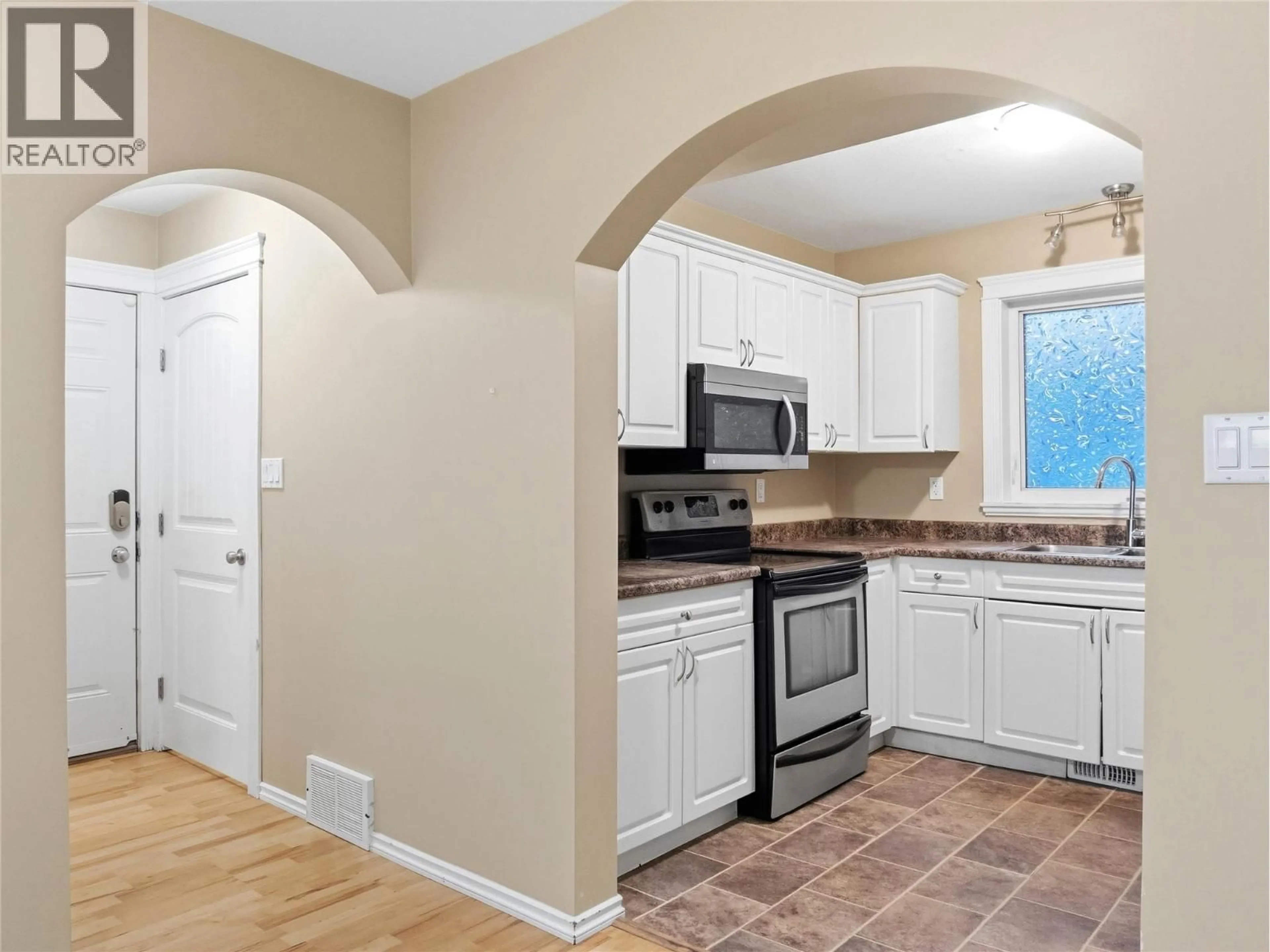 Open concept kitchen, ceramic/tile floor for 721 100 AVENUE, Dawson Creek British Columbia V1G0B5