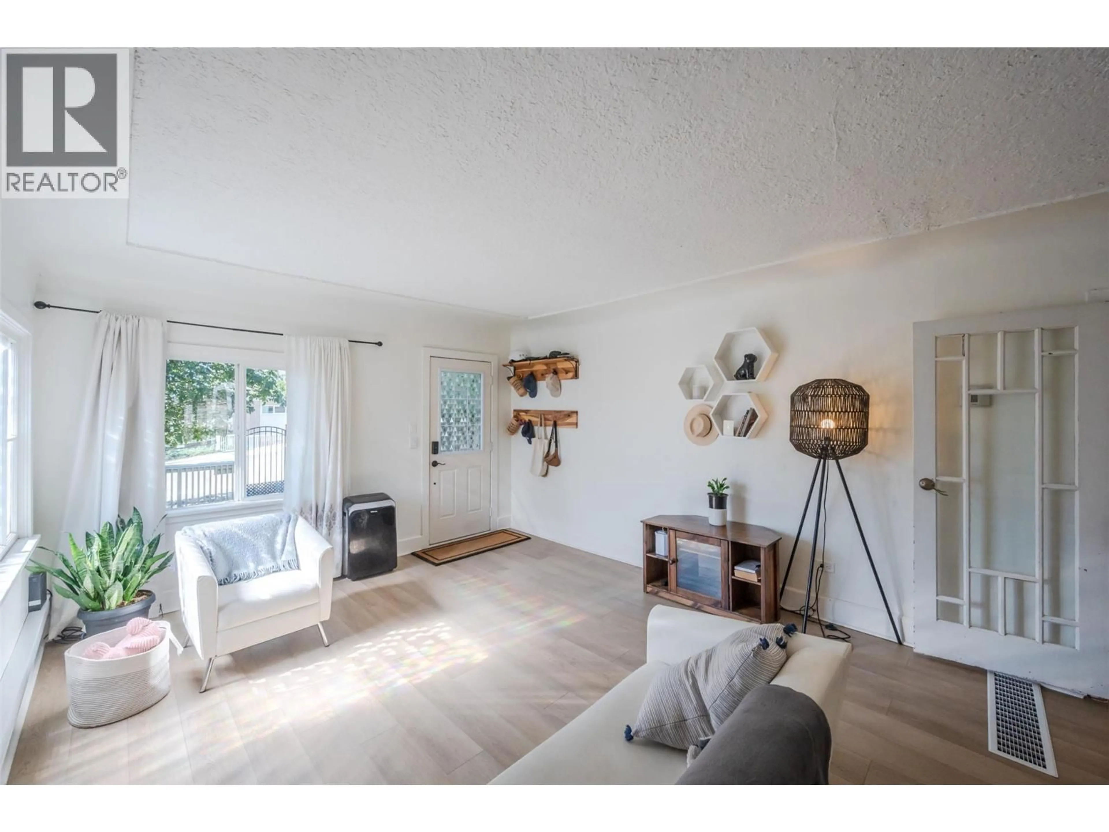 Living room with furniture, wood/laminate floor for 294 NORTON STREET, Penticton British Columbia V2A4H7