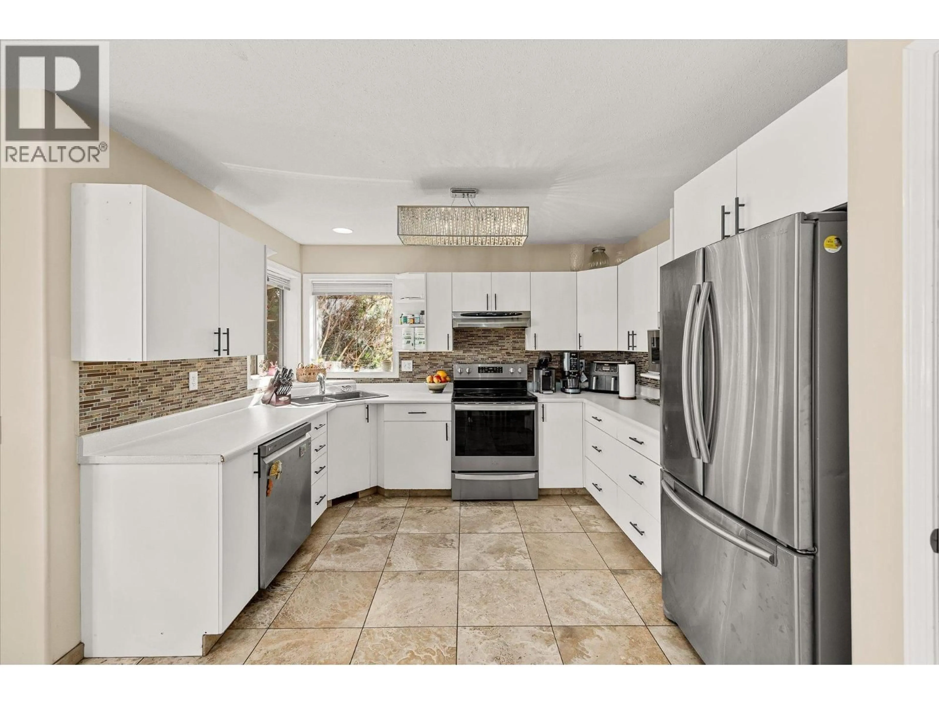 Open concept kitchen, ceramic/tile floor for 144 WYNDHAM CRESCENT, Kelowna British Columbia V1V1Z1