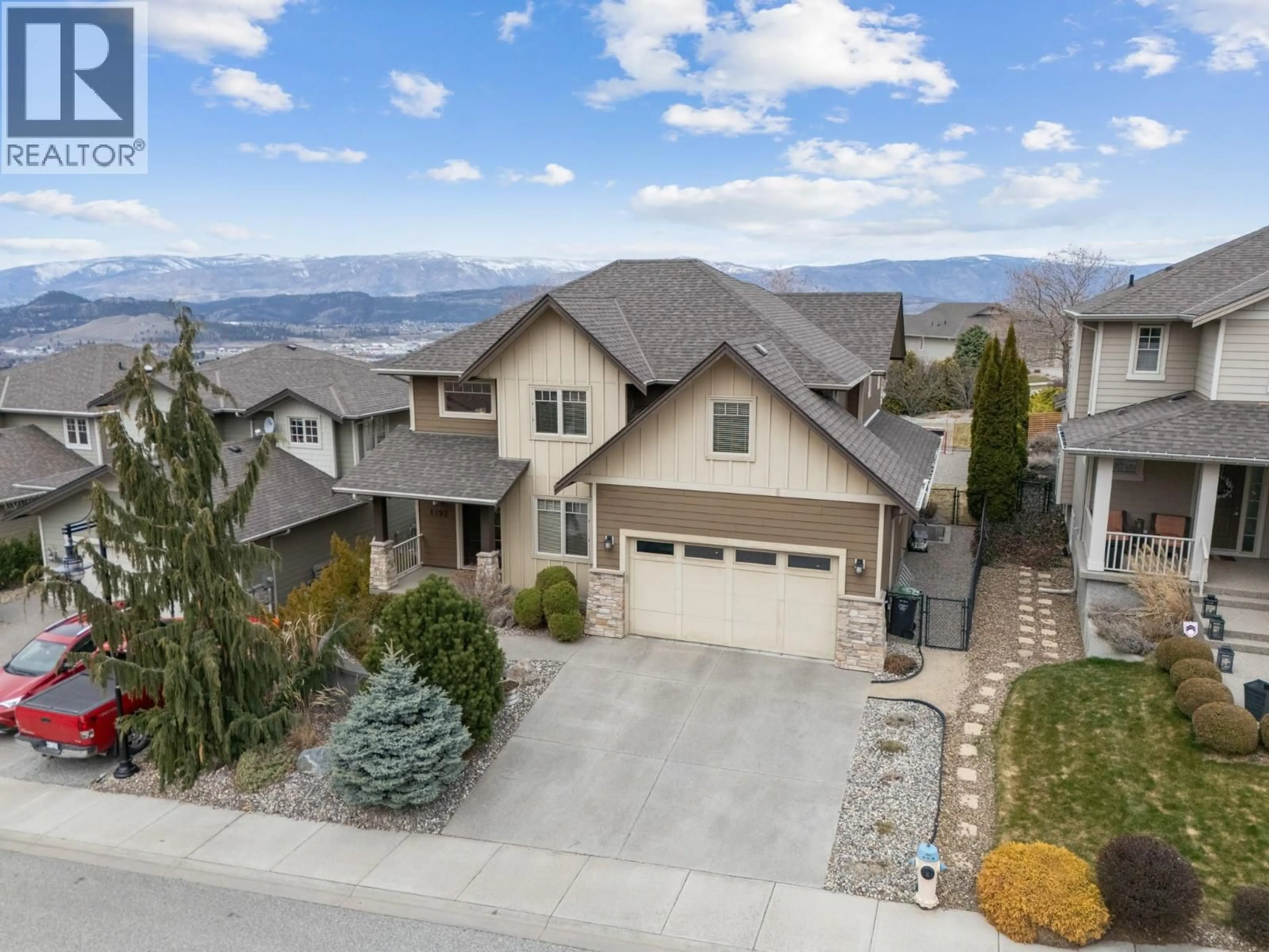 A pic from outside/outdoor area/front of a property/back of a property/a pic from drone, mountain view for 1792 SPLIT RAIL PLACE, Kelowna British Columbia V1P1R1