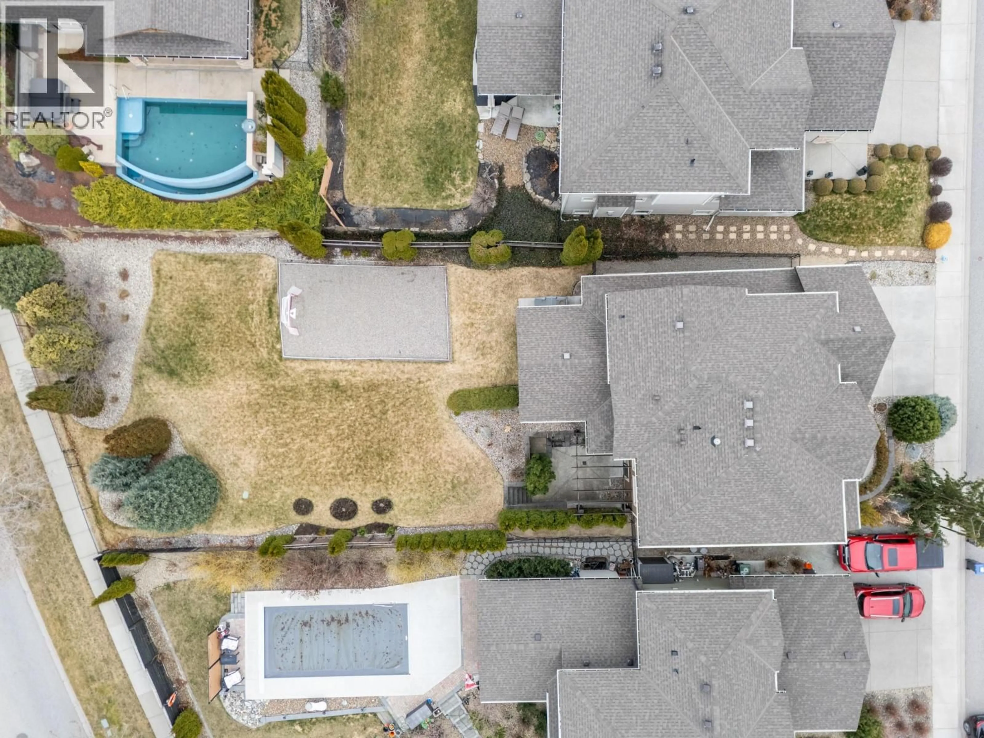 A pic from outside/outdoor area/front of a property/back of a property/a pic from drone, street for 1792 SPLIT RAIL PLACE, Kelowna British Columbia V1P1R1