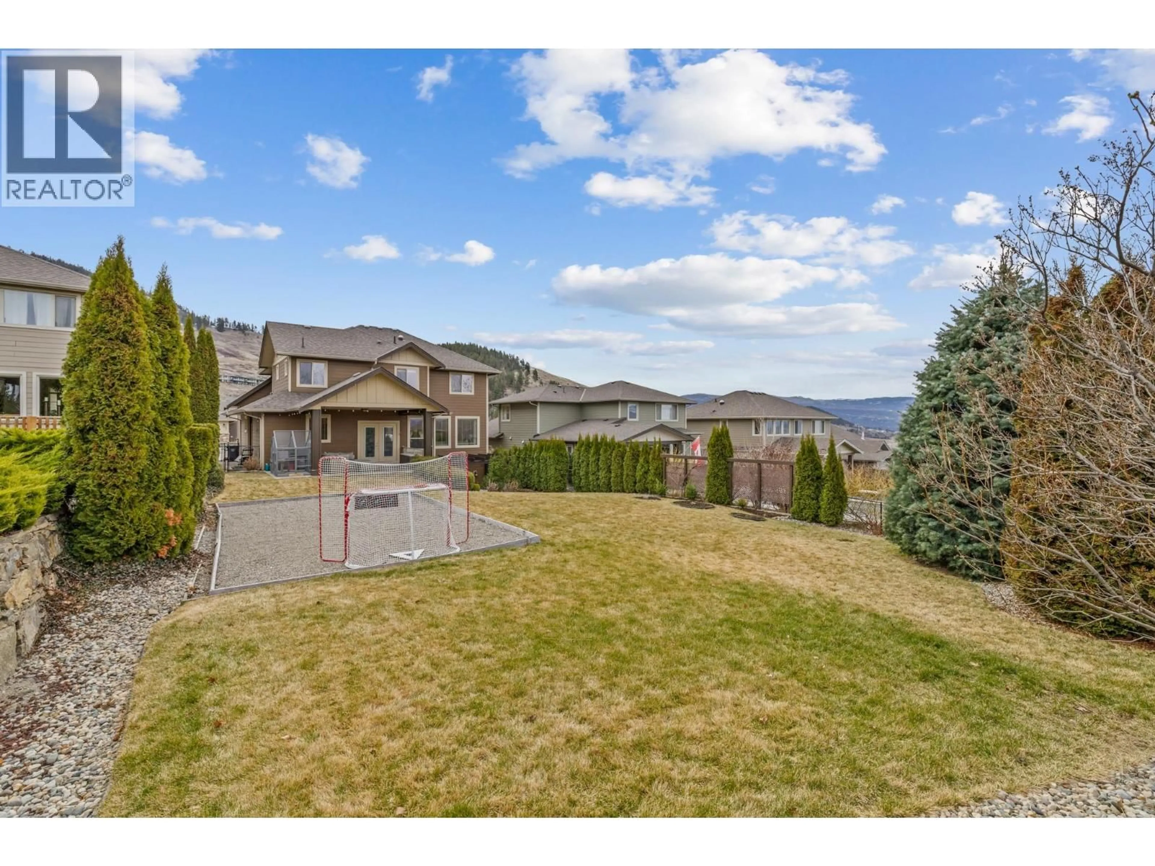 A pic from outside/outdoor area/front of a property/back of a property/a pic from drone, mountain view for 1792 SPLIT RAIL PLACE, Kelowna British Columbia V1P1R1