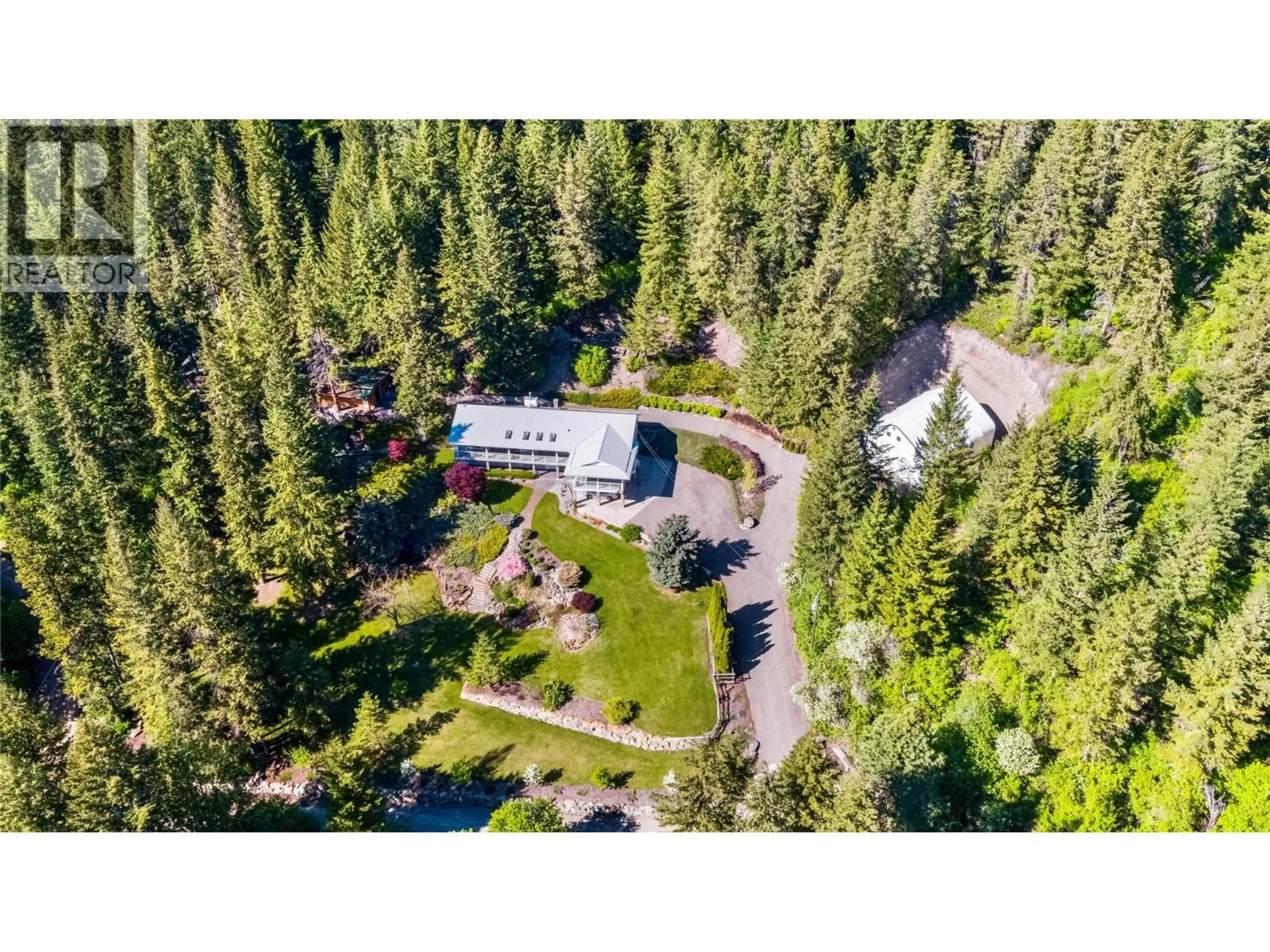 A pic from outside/outdoor area/front of a property/back of a property/a pic from drone, forest/trees view for 3855 TURNER ROAD, Tappen British Columbia V0E2X1