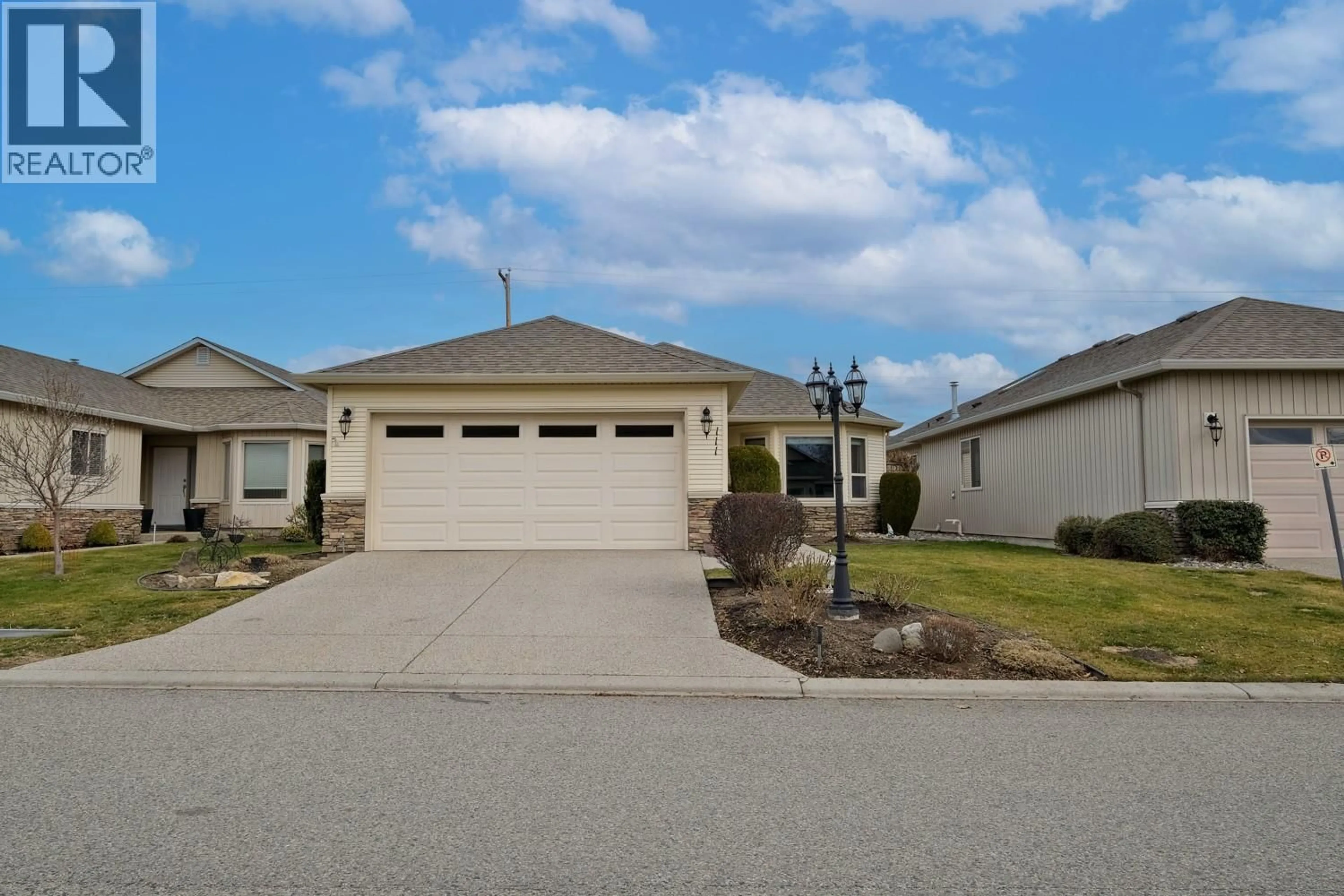 Home with vinyl exterior material, street for 111 - 2365 STILLINGFLEET ROAD, Kelowna British Columbia V1W4X5