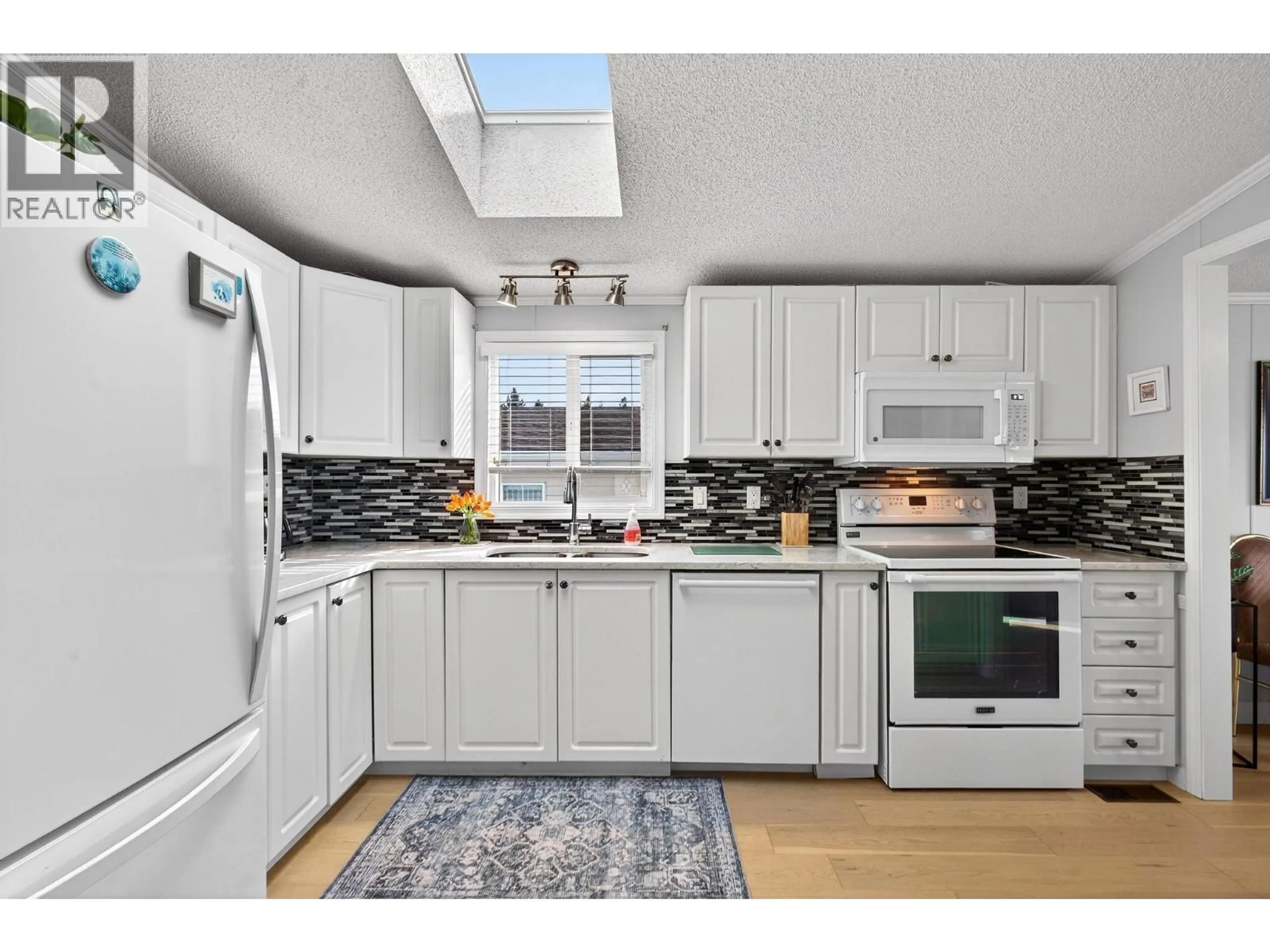 Open concept kitchen, unknown for 109 - 1850 SHANNON LAKE ROAD, West Kelowna British Columbia V1Z1A9