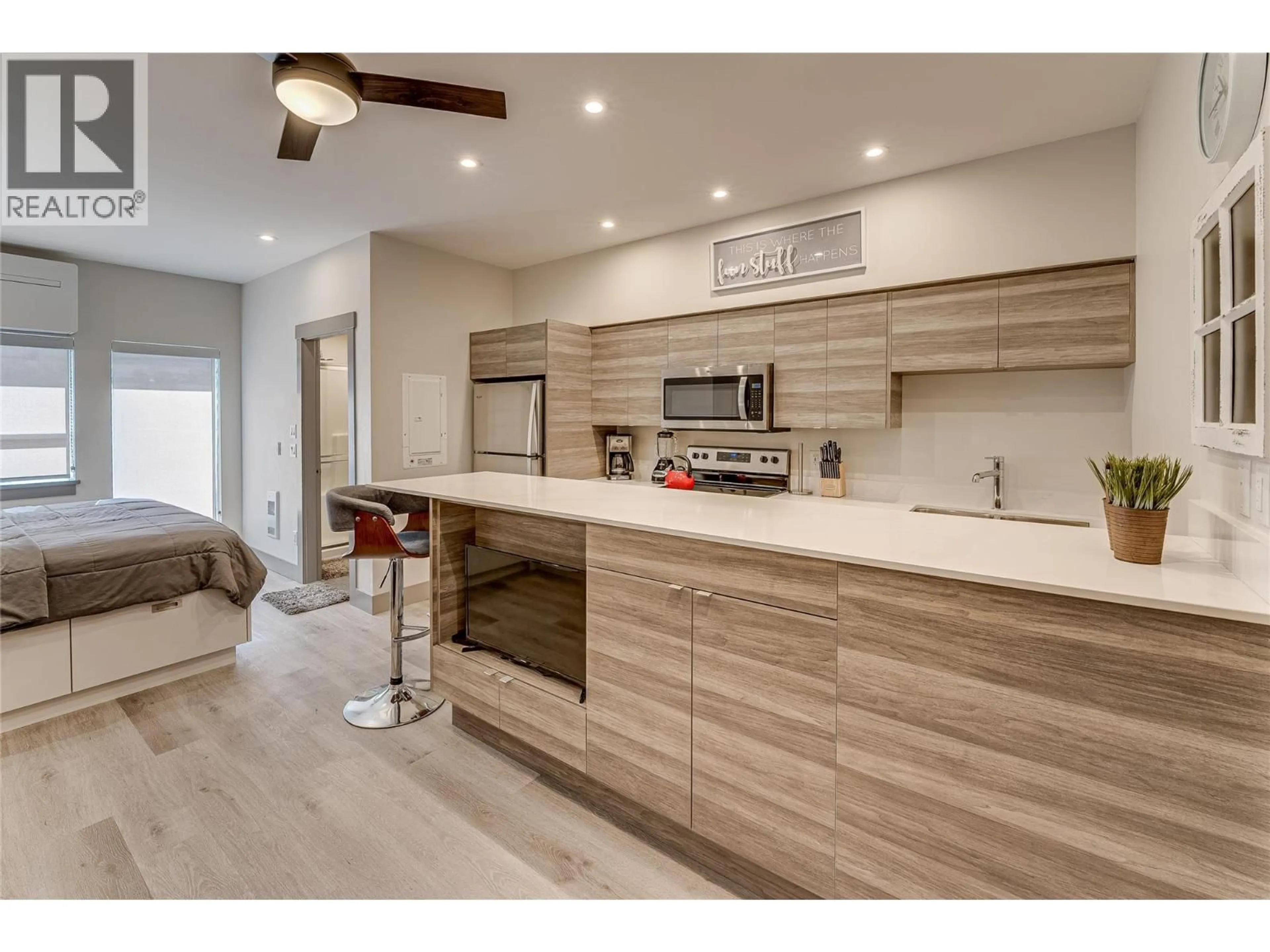 Open concept kitchen, wood/laminate floor for 321 - 2555 LAKESHORE ROAD, Vernon British Columbia V1H1M9