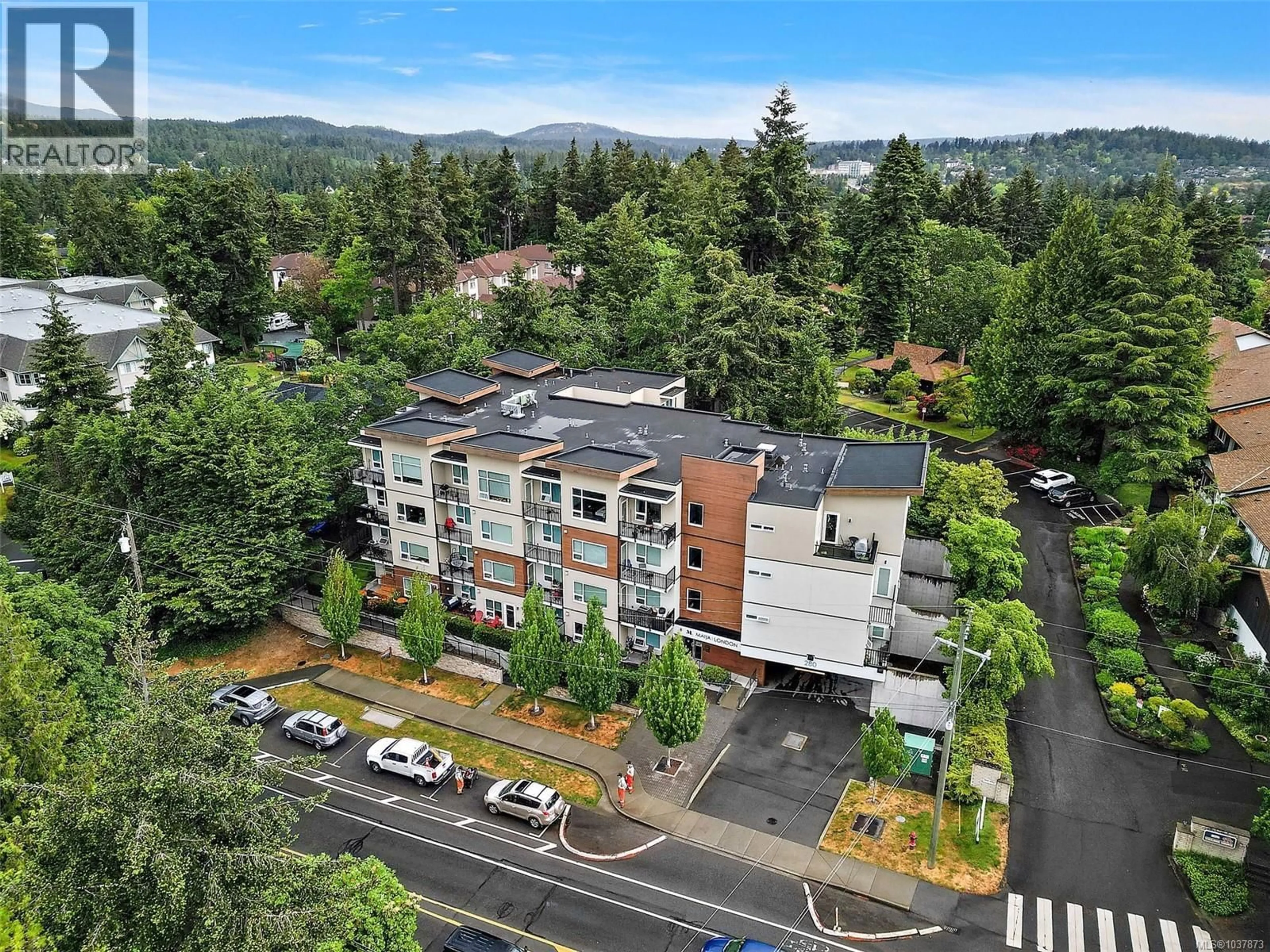 A pic from outside/outdoor area/front of a property/back of a property/a pic from drone, mountain view for 309 - 280 ISLAND HIGHWAY, View Royal British Columbia V9B1G5