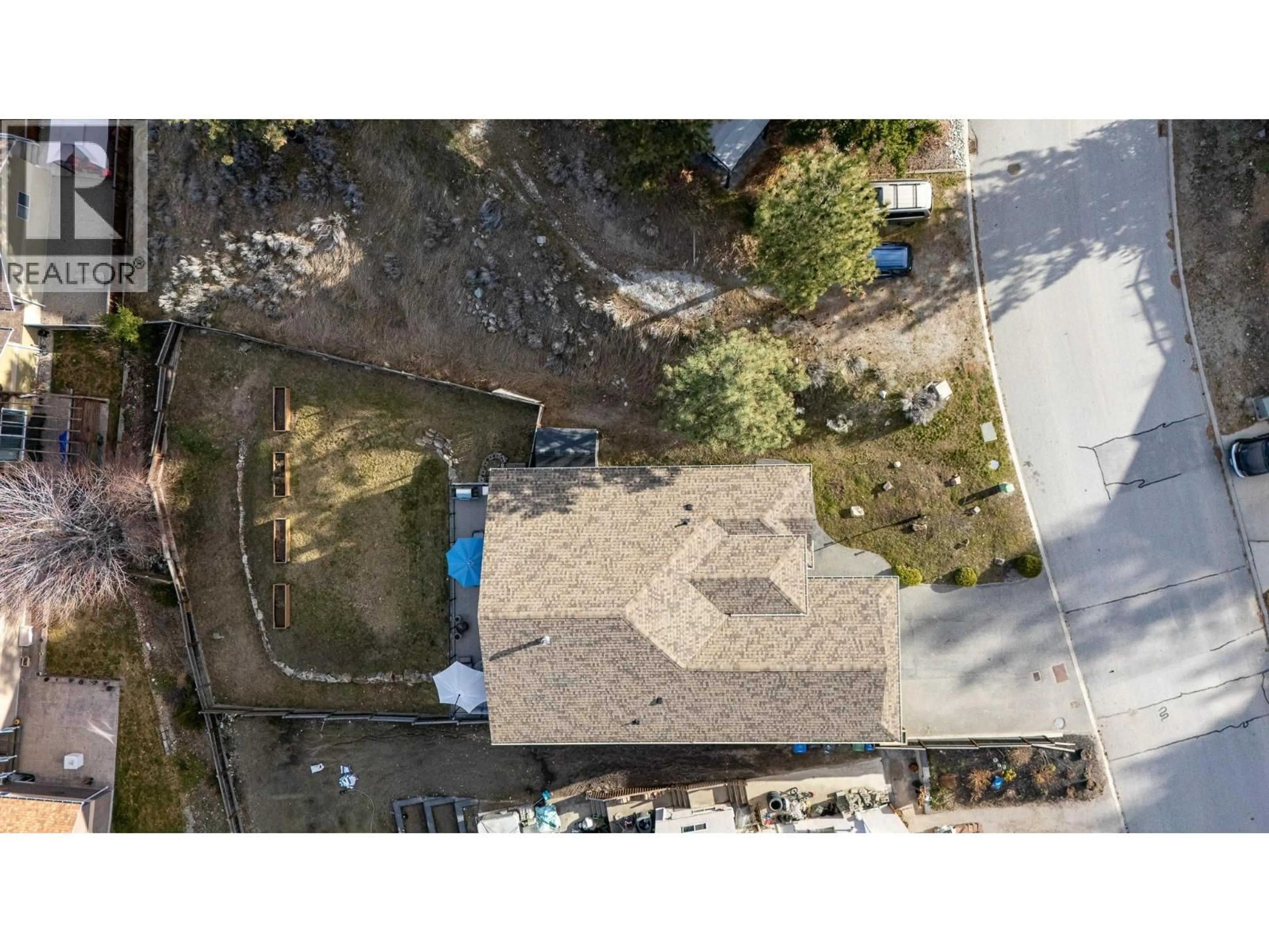 A pic from outside/outdoor area/front of a property/back of a property/a pic from drone, street for 8722 POLLOCK TERRACE, Summerland British Columbia V0H1Z2
