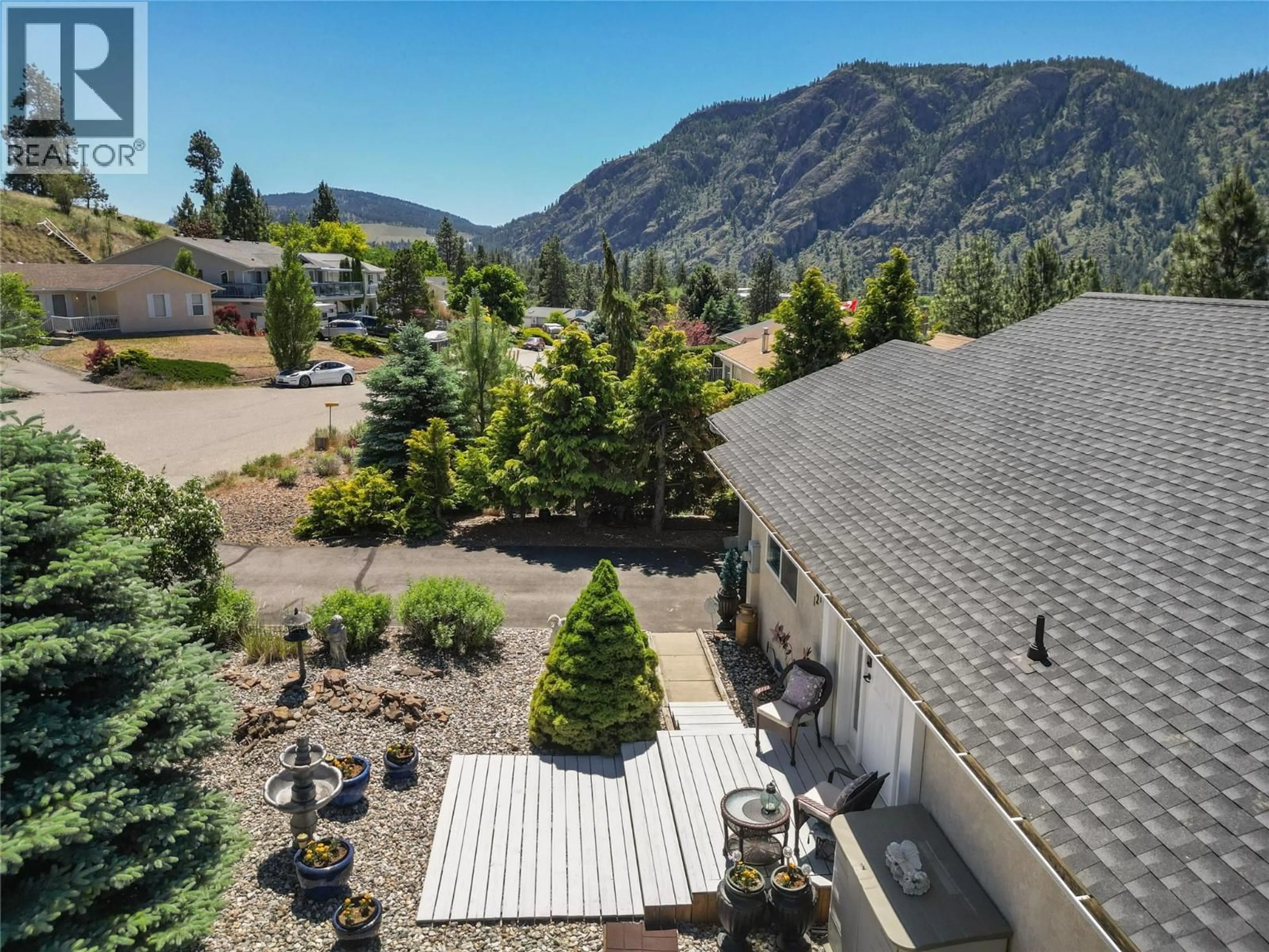 A pic from outside/outdoor area/front of a property/back of a property/a pic from drone, mountain view for 1214 PEACHCLIFF DRIVE, Okanagan Falls British Columbia V0H1R1