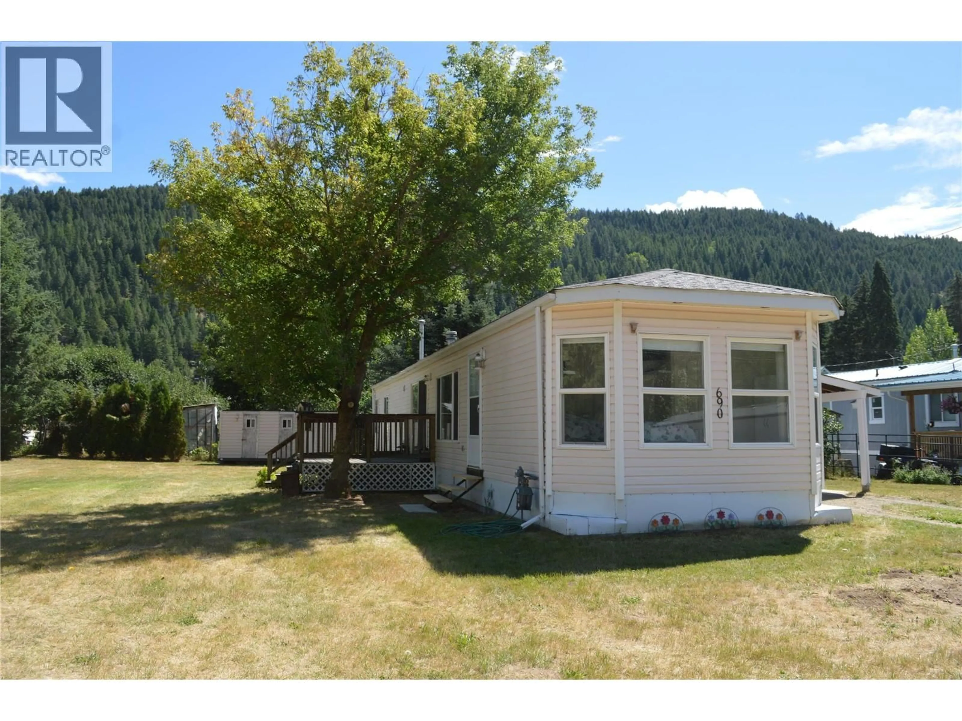 Home with vinyl exterior material, mountain view for 690 COPPER AVENUE NORTH, Greenwood British Columbia V0H1J0