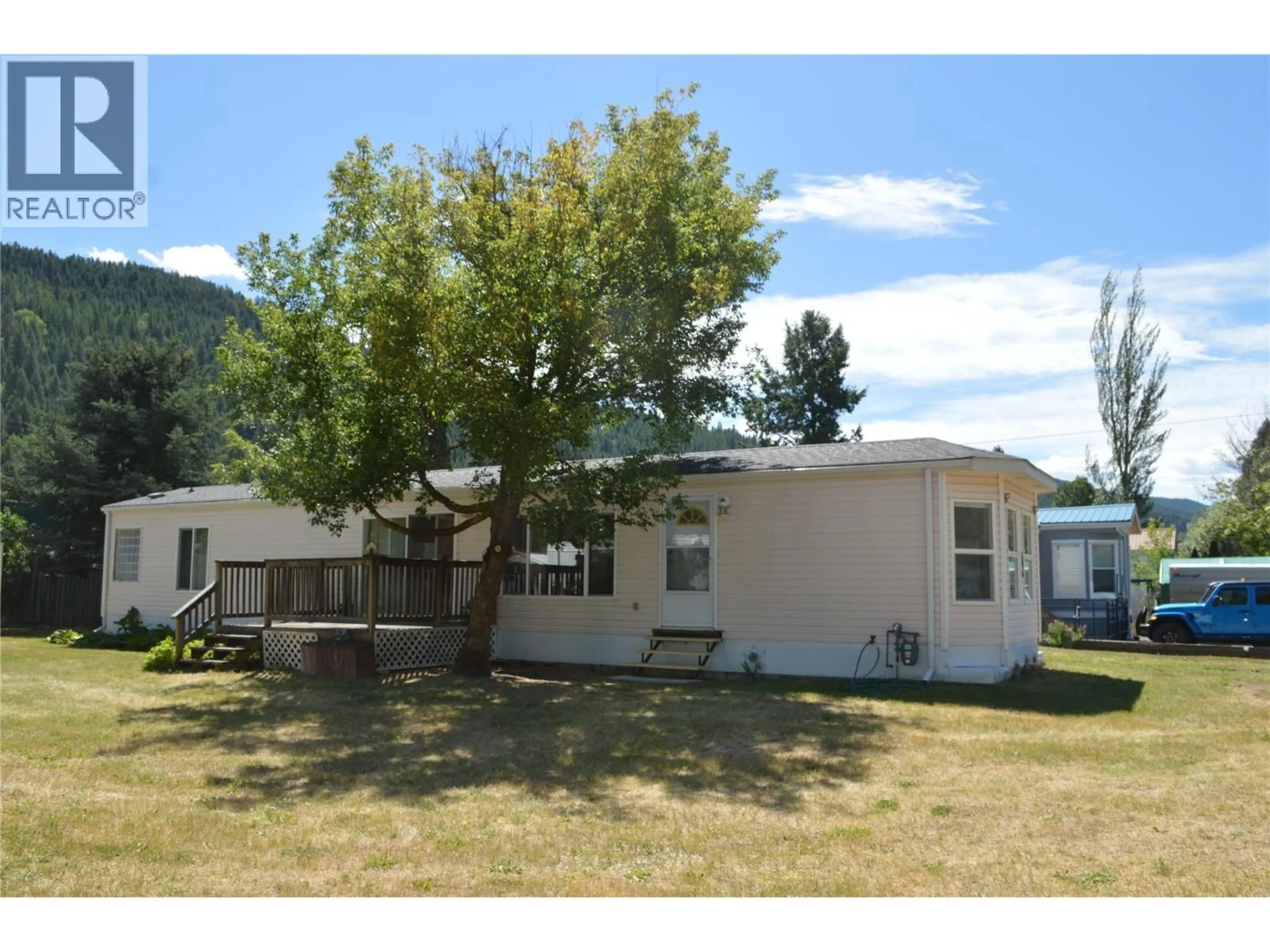 Home with vinyl exterior material, mountain view for 690 COPPER AVENUE NORTH, Greenwood British Columbia V0H1J0