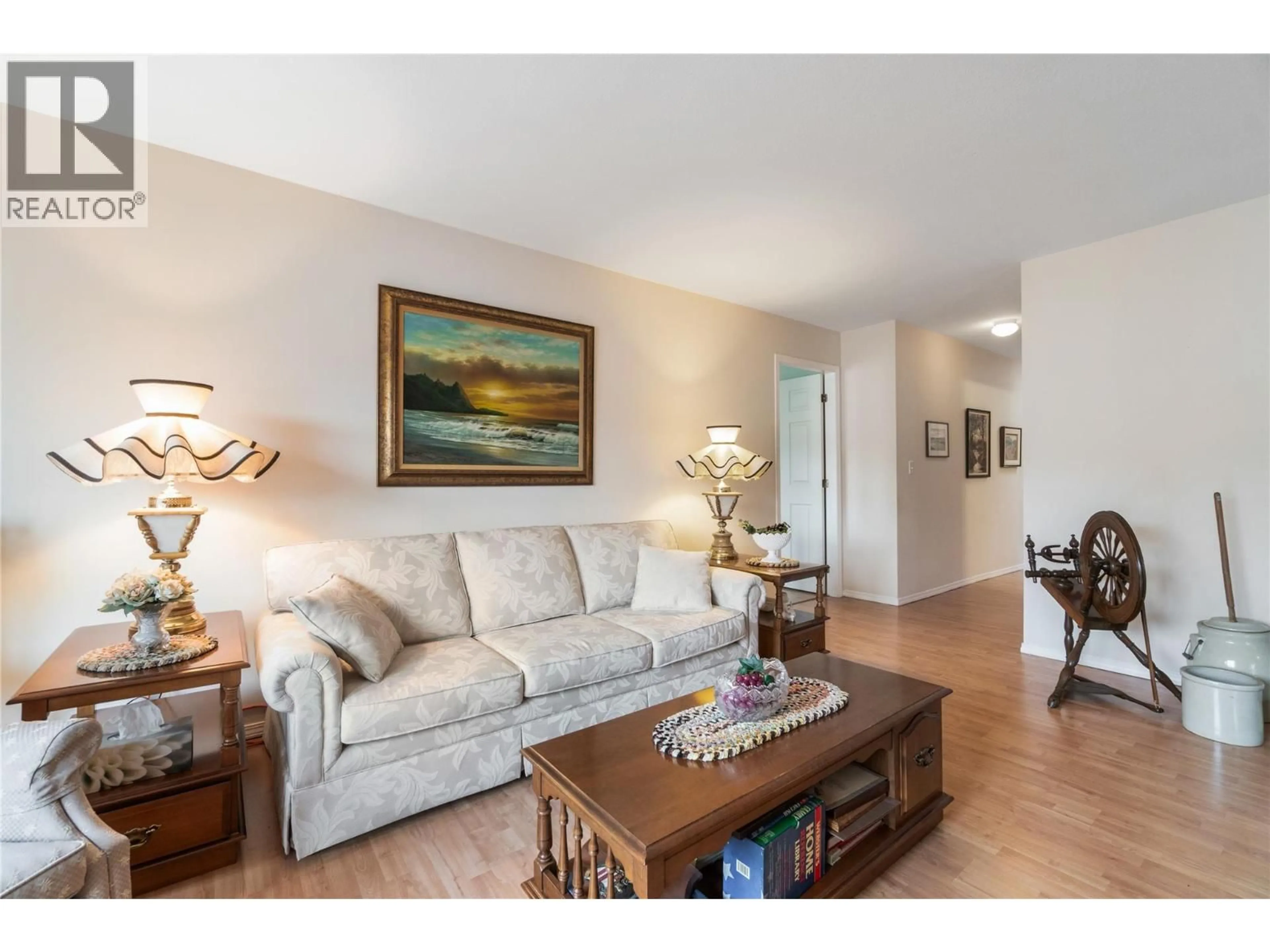 Living room with furniture, wood/laminate floor for 306 - 251 6 STREET SOUTHEAST, Salmon Arm British Columbia V1E1J9