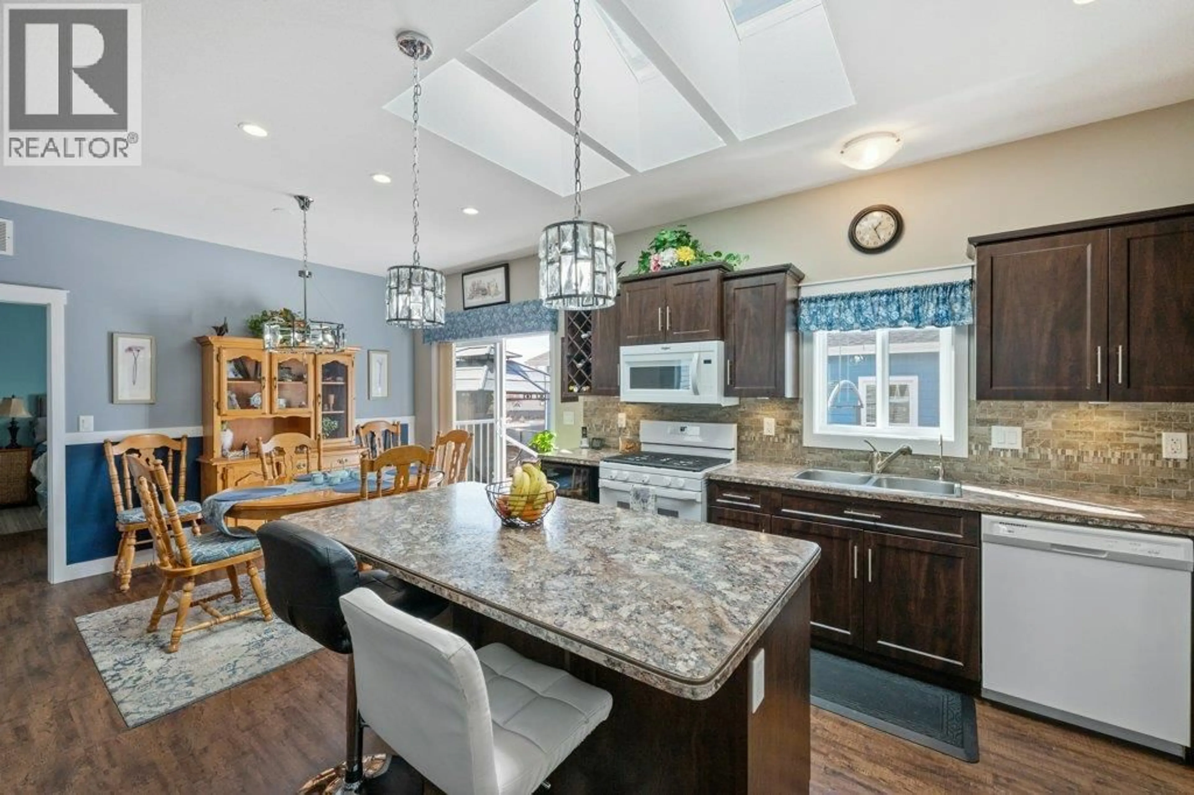 Open concept kitchen, ceramic/tile floor for 122 - 8300 GALLAGHER LAKE FRONTAGE ROAD, Oliver British Columbia V0H1T2