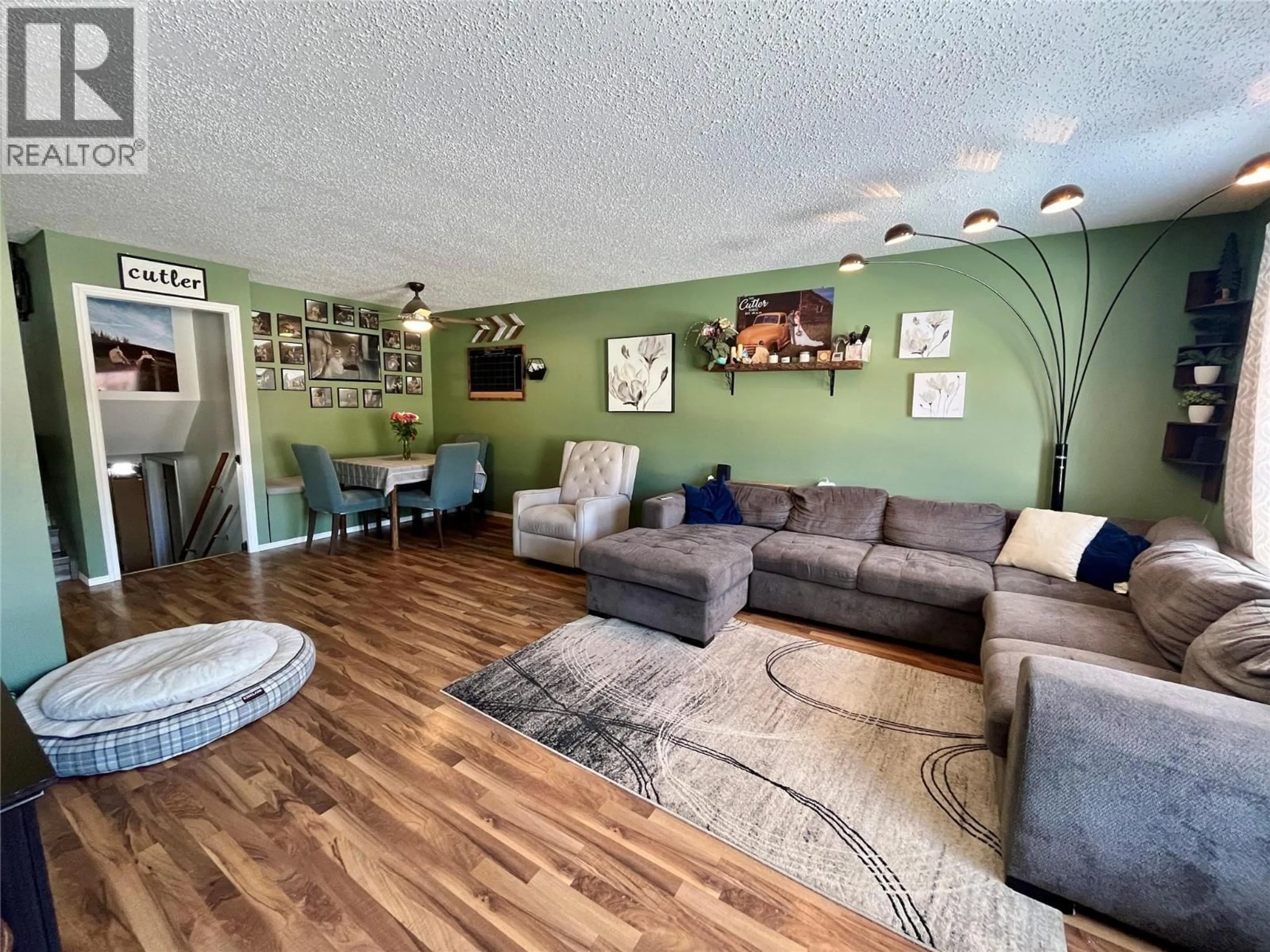 Living room with furniture, wood/laminate floor for 320 WILLOW DRIVE, Tumbler Ridge British Columbia V0C2W0