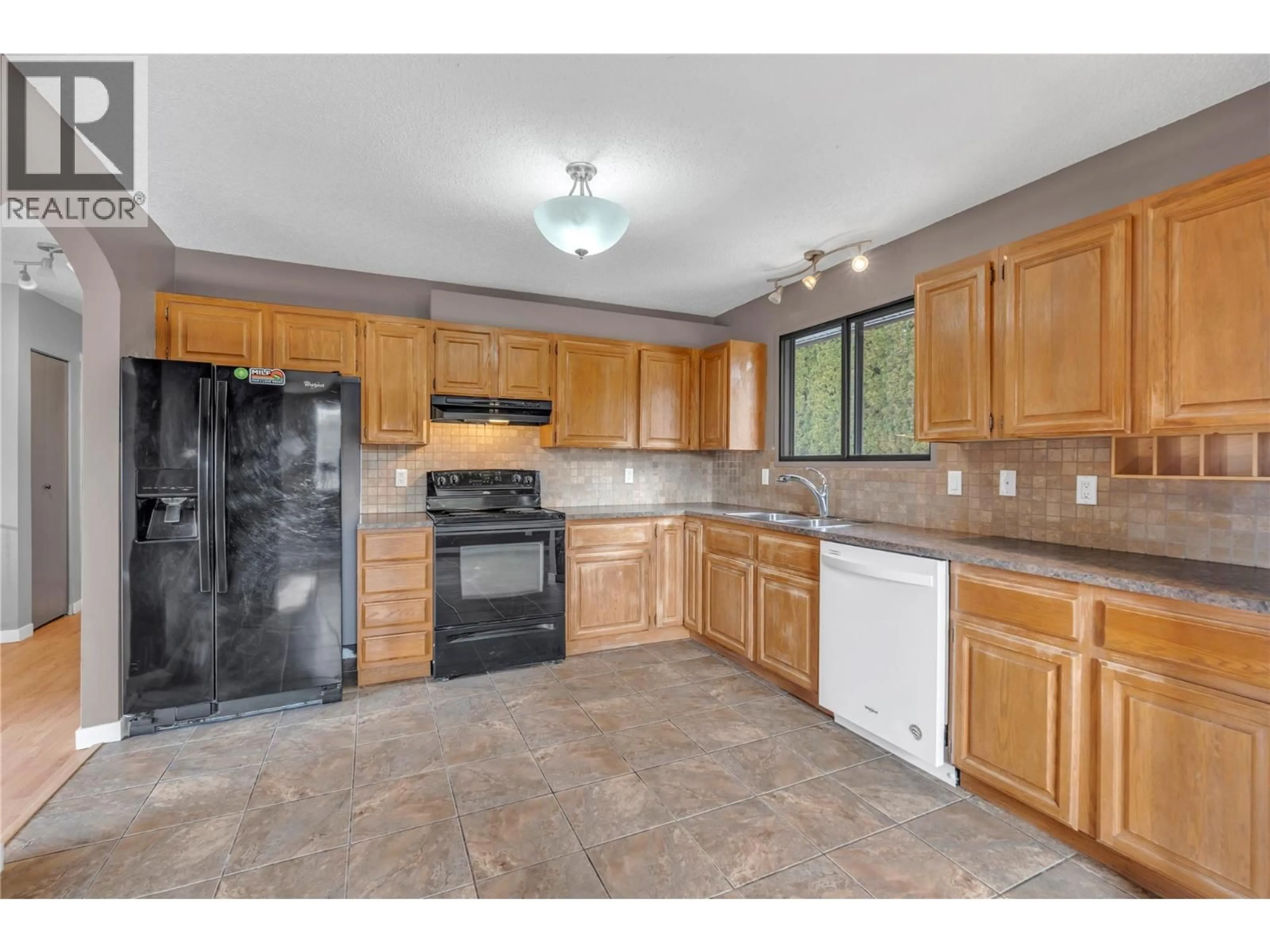Standard kitchen, ceramic/tile floor for 2550 WILTSE DRIVE, Penticton British Columbia V2A7X5