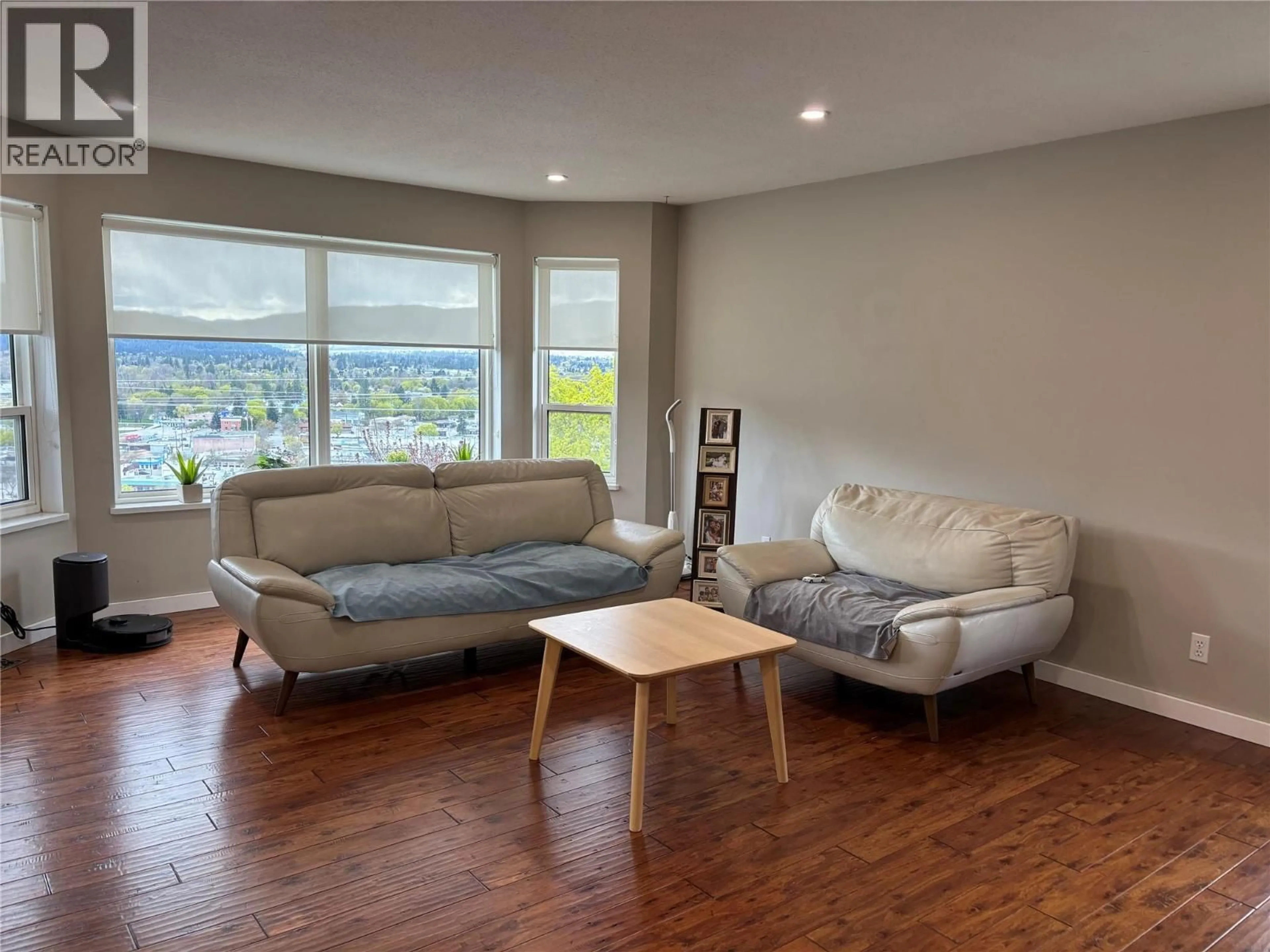 Living room with furniture, wood/laminate floor for 7415 VALLEY HEIGHTS DRIVE, Grand Forks British Columbia V0H1H0
