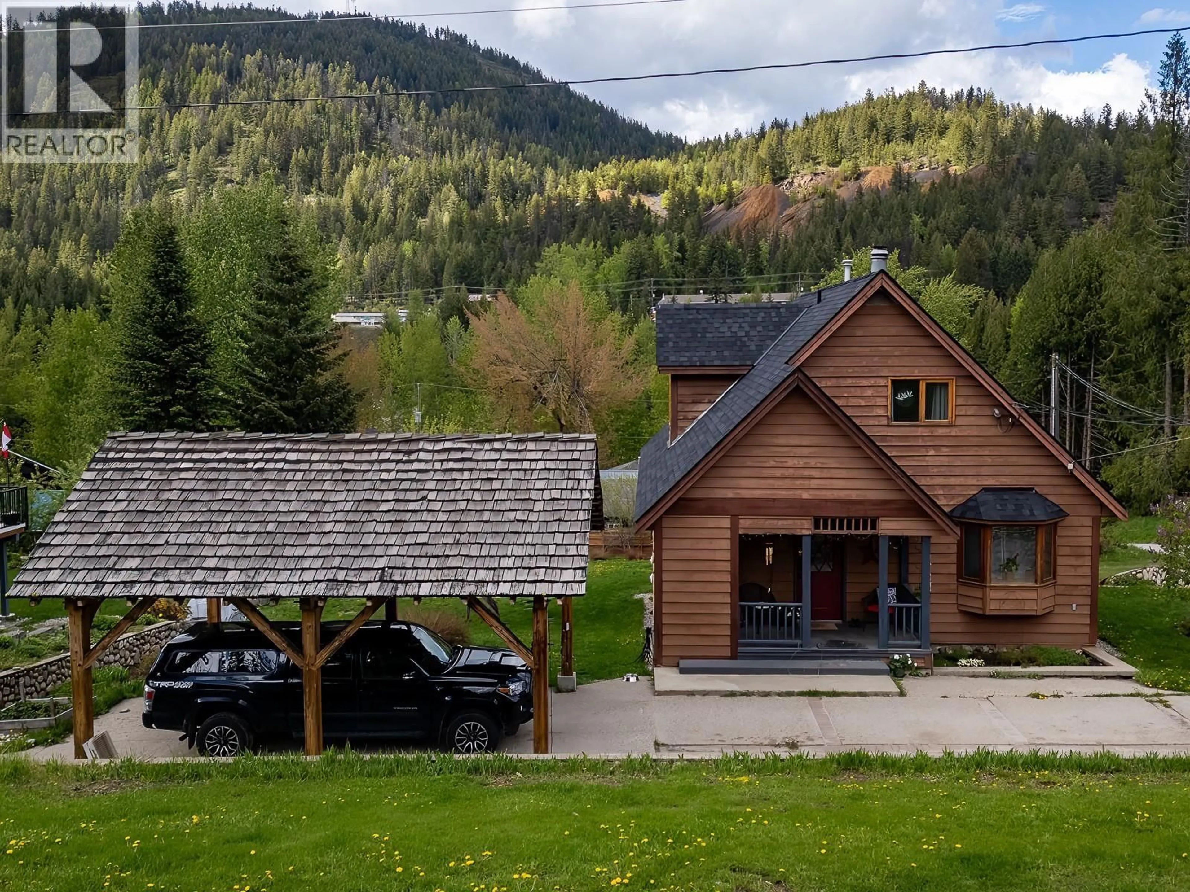 A pic from outside/outdoor area/front of a property/back of a property/a pic from drone, mountain view for 1190 BLACK BEAR DRIVE, Rossland British Columbia V0G1Y0