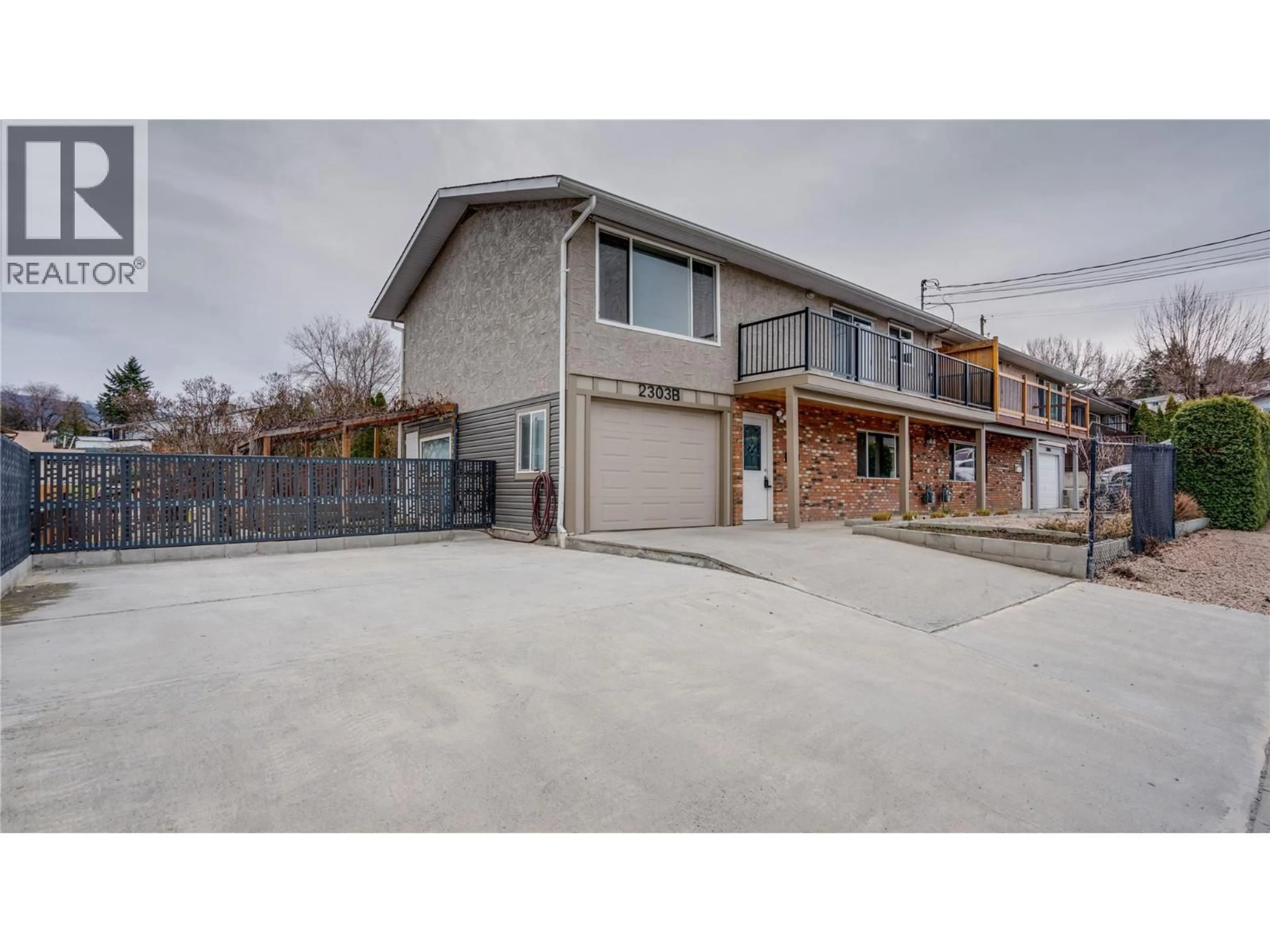 A pic from outside/outdoor area/front of a property/back of a property/a pic from drone, street for 2303B 39 STREET, Vernon British Columbia V1T7W9