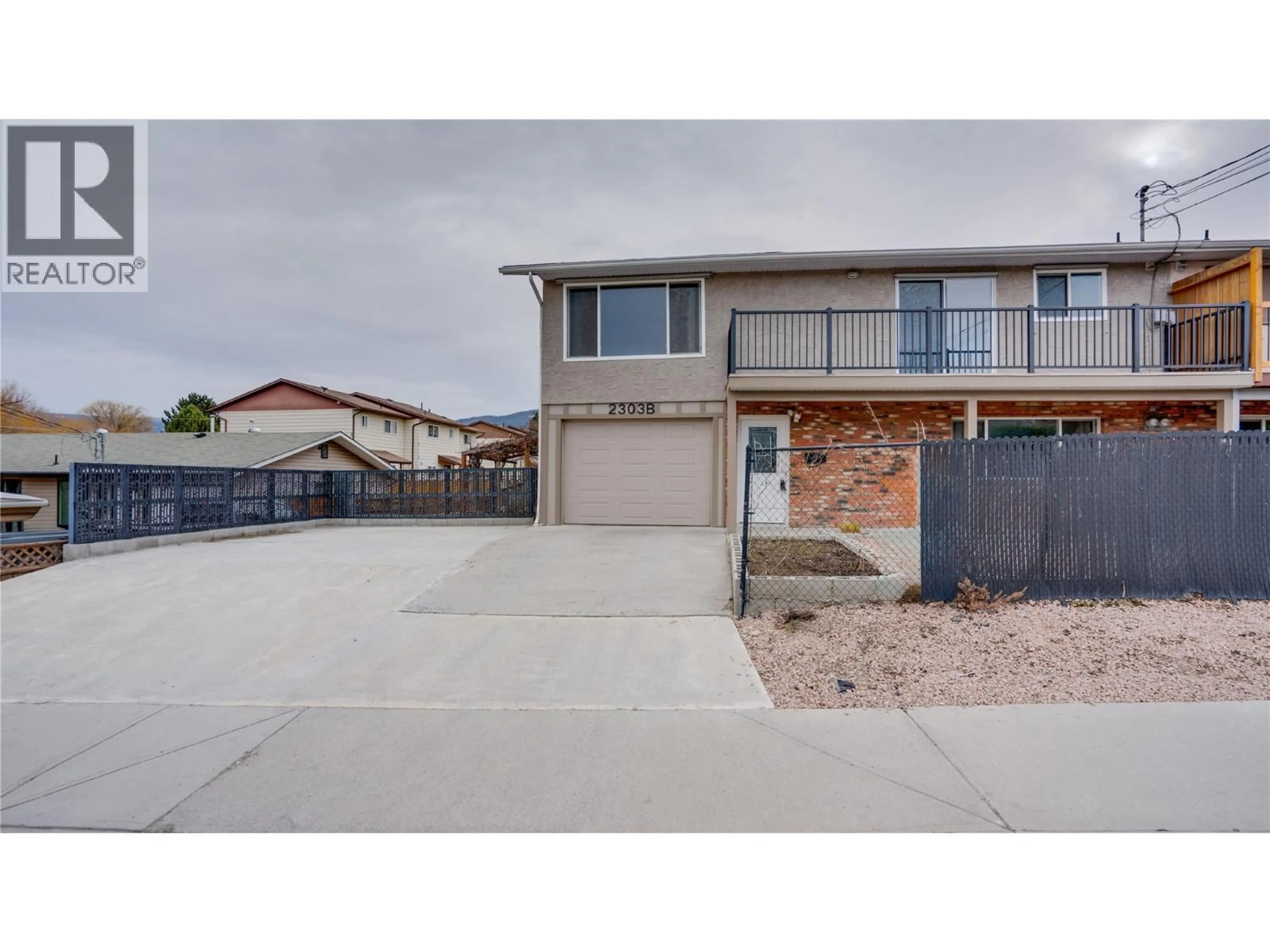 A pic from outside/outdoor area/front of a property/back of a property/a pic from drone, street for 2303B 39 STREET, Vernon British Columbia V1T7W9