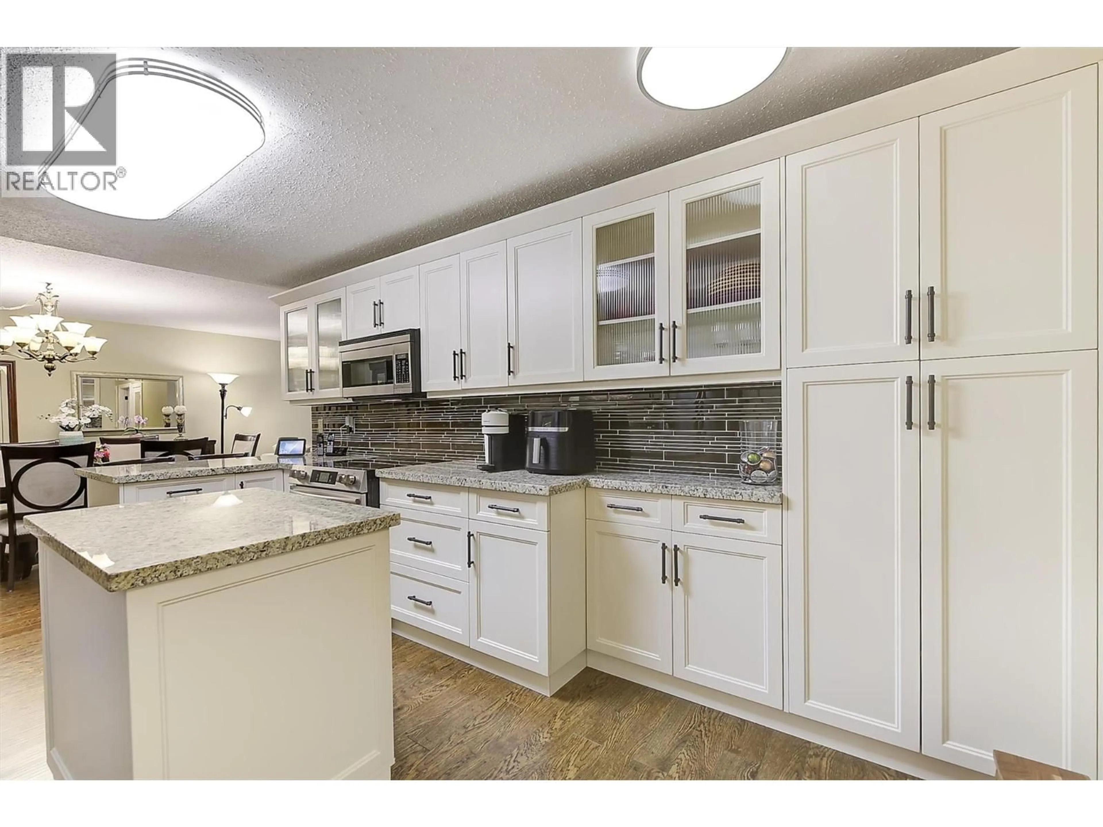Open concept kitchen, ceramic/tile floor for 103 - 2477 INGRAM ROAD, West Kelowna British Columbia V4T1W7