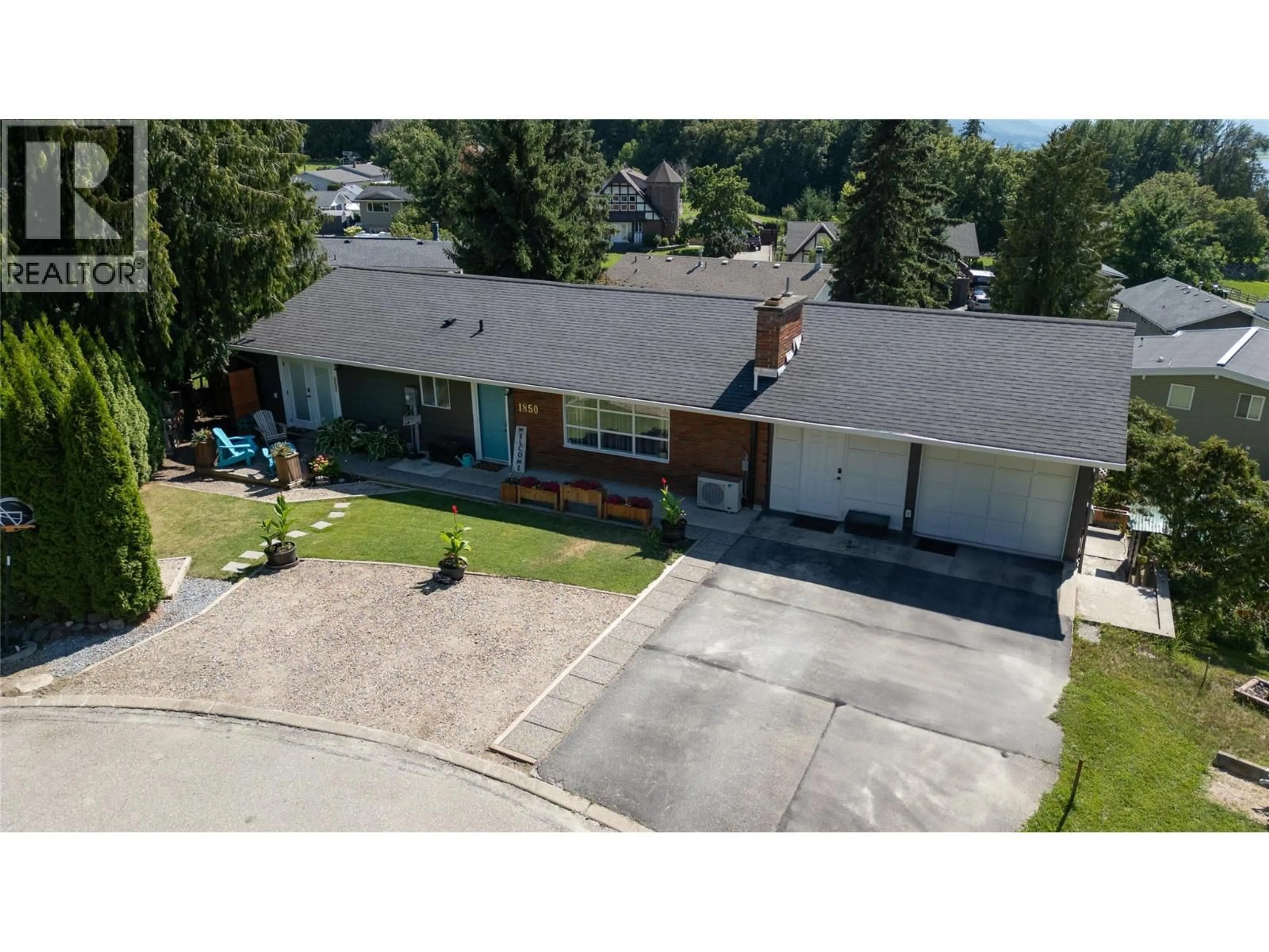 A pic from outside/outdoor area/front of a property/back of a property/a pic from drone, street for 1850 28 AVENUE NORTHEAST, Salmon Arm British Columbia V1E3X1