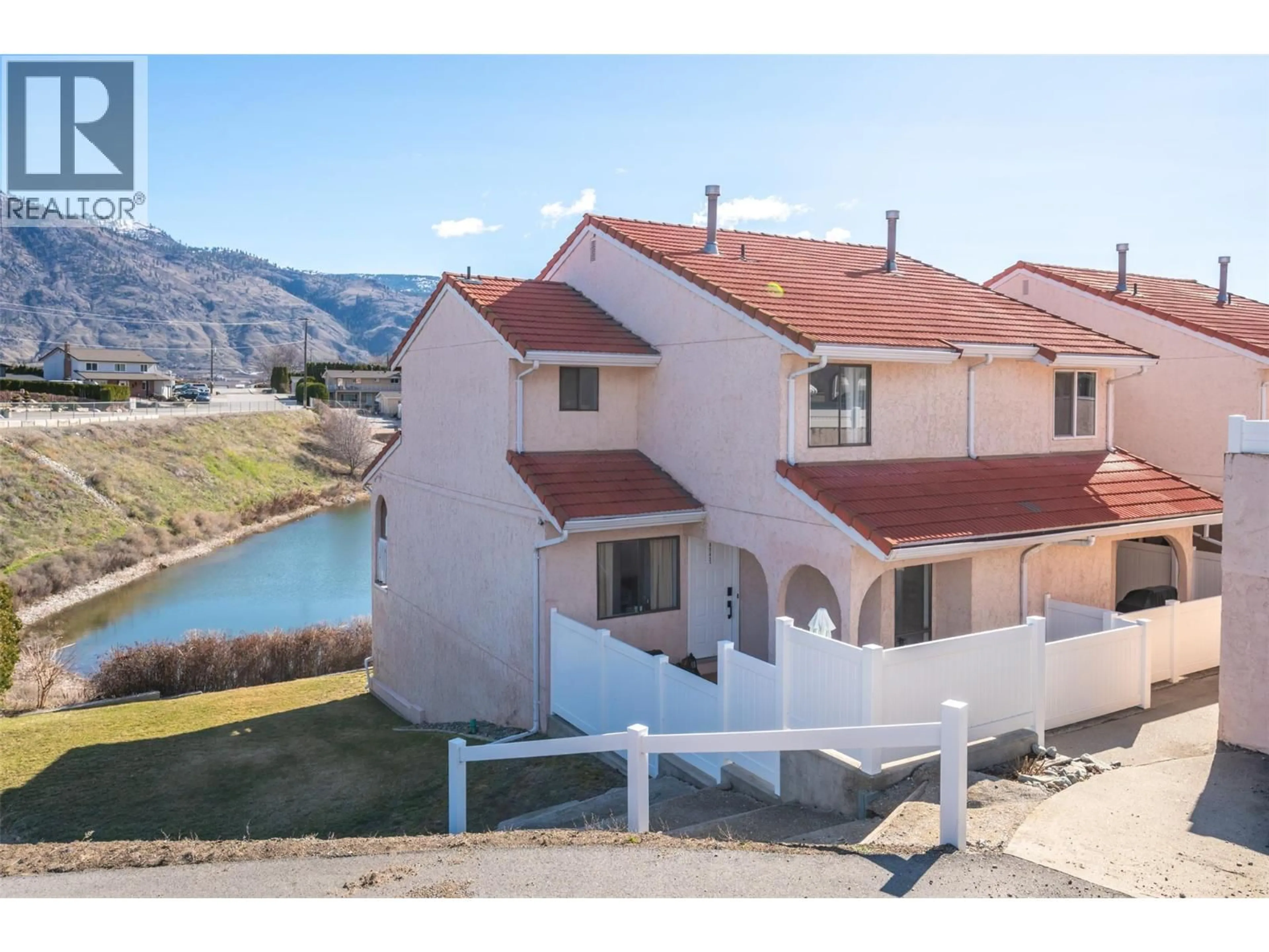 A pic from outside/outdoor area/front of a property/back of a property/a pic from drone, water/lake/river/ocean view for 1A - 8043 VEDETTE DRIVE, Osoyoos British Columbia V0H1V2