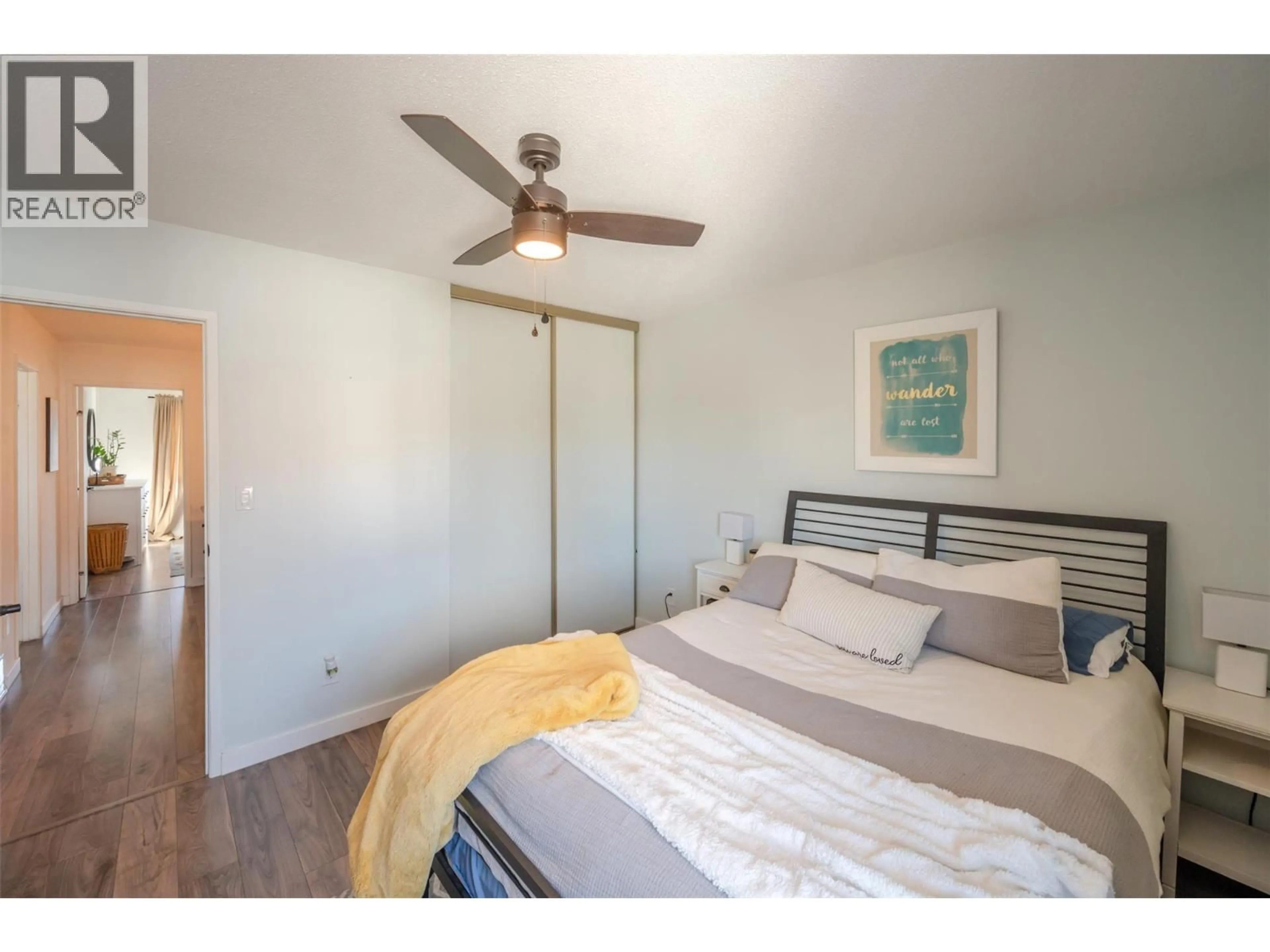 Bedroom with bed, wood/laminate floor for 1A - 8043 VEDETTE DRIVE, Osoyoos British Columbia V0H1V2