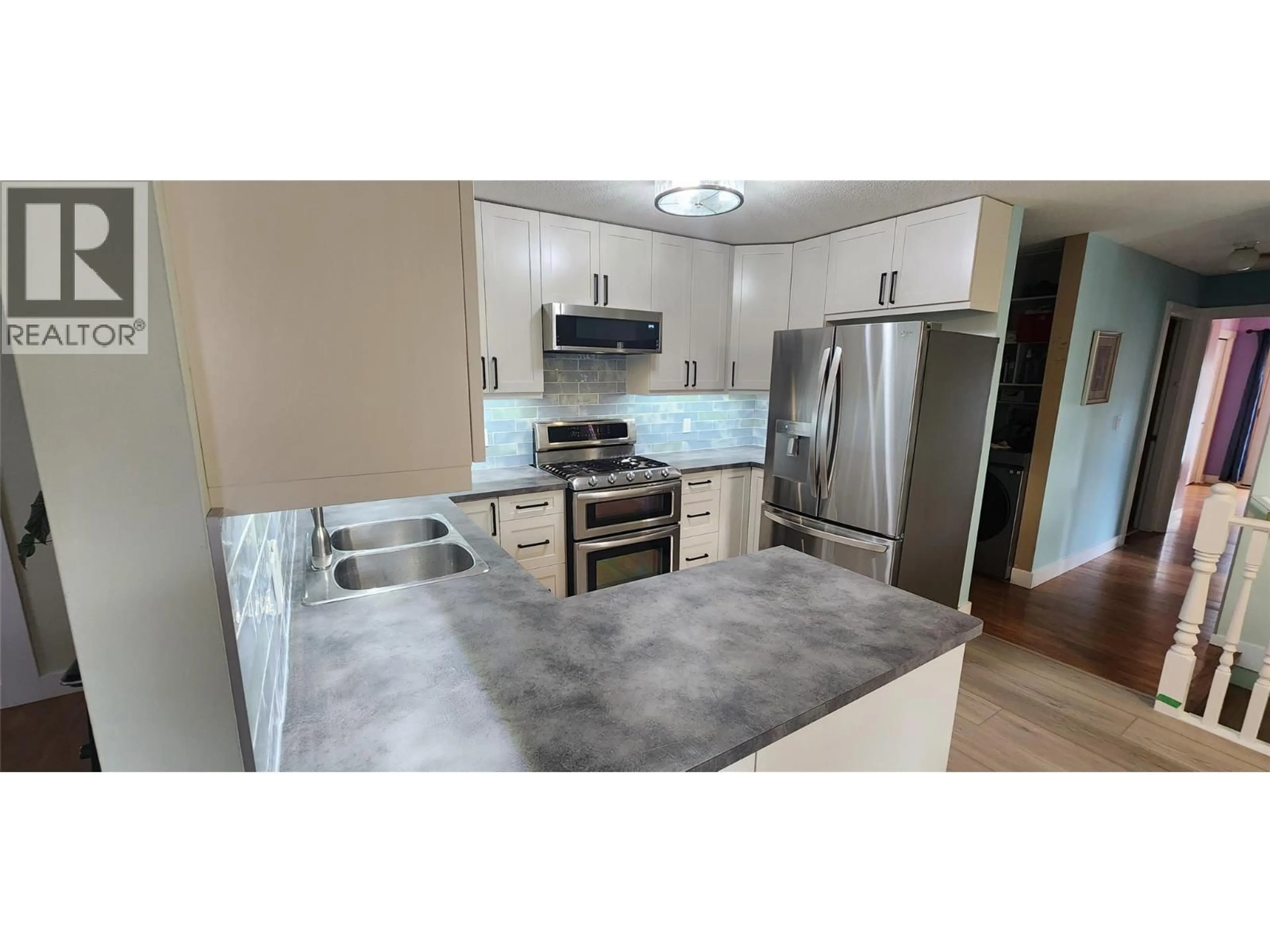 Standard kitchen, ceramic/tile floor for 7766 18TH STREET, Grand Forks British Columbia V0H1H2