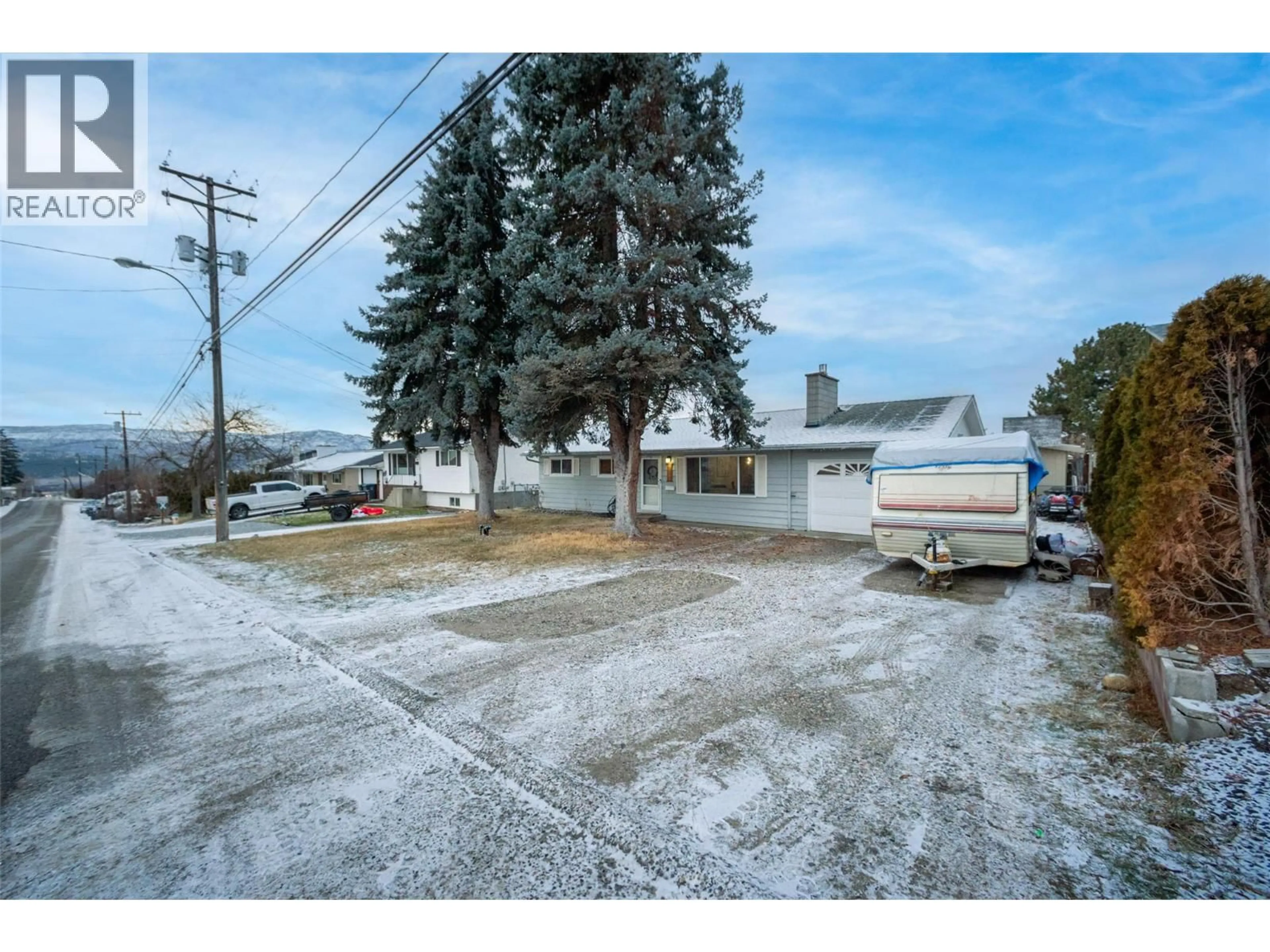 A pic from outside/outdoor area/front of a property/back of a property/a pic from drone, street for 4840 SCOTTY CREEK ROAD, Kelowna British Columbia V1X6J8