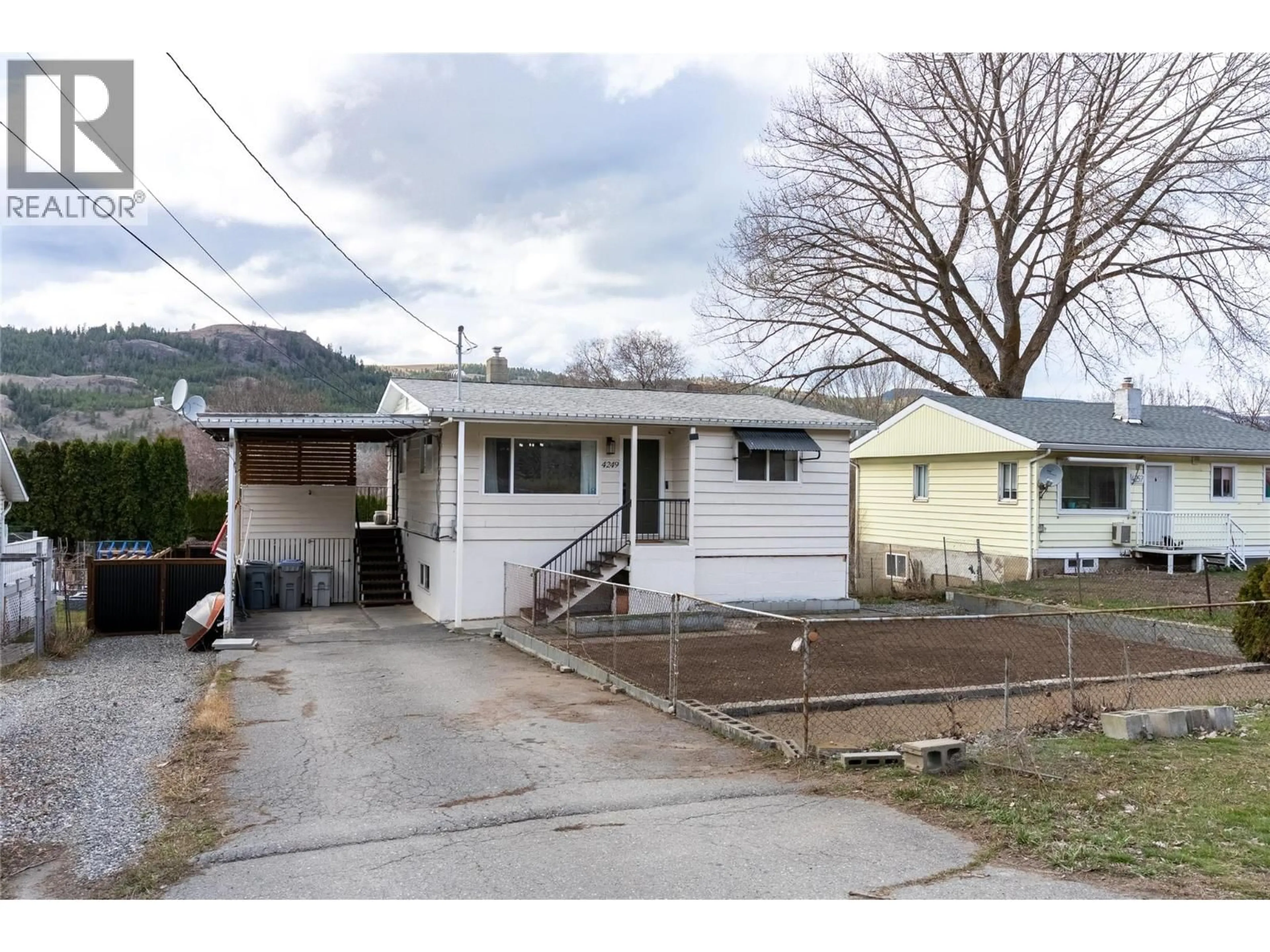 Home with vinyl exterior material, street for 4249 OLD YELLOWHEAD HIGHWAY, Kamloops British Columbia V2H1N4