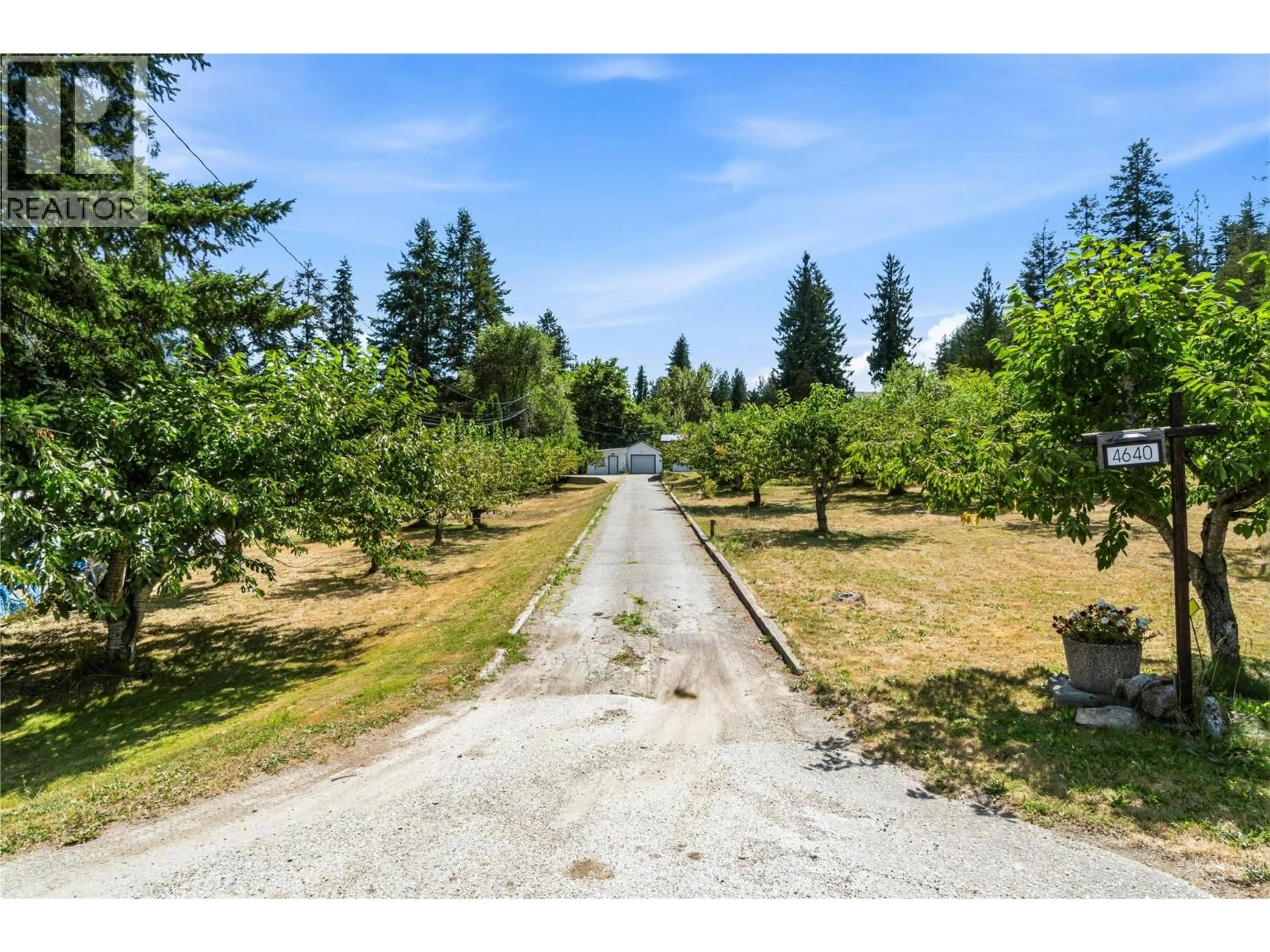 A pic from outside/outdoor area/front of a property/back of a property/a pic from drone, forest/trees view for 4640 70 AVENUE NORTHEAST, Salmon Arm British Columbia V0E1K0