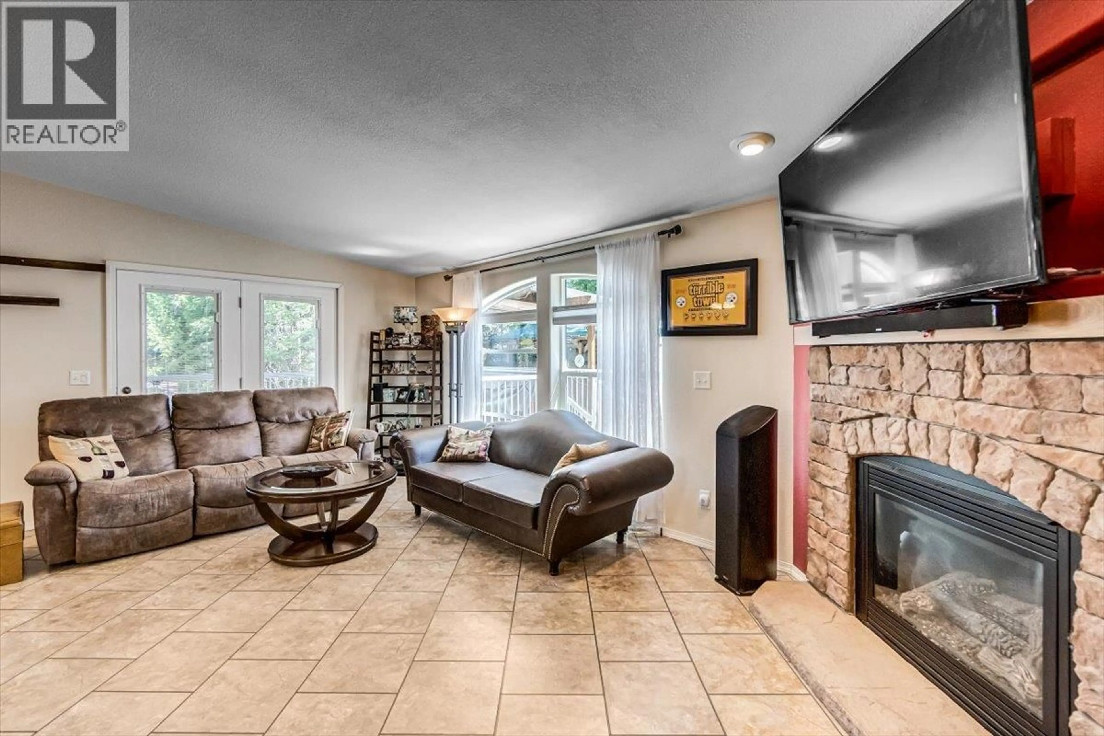 Living room with furniture, ceramic/tile floor for 1601 BEECH ROAD, Christina Lake British Columbia V0H1E0