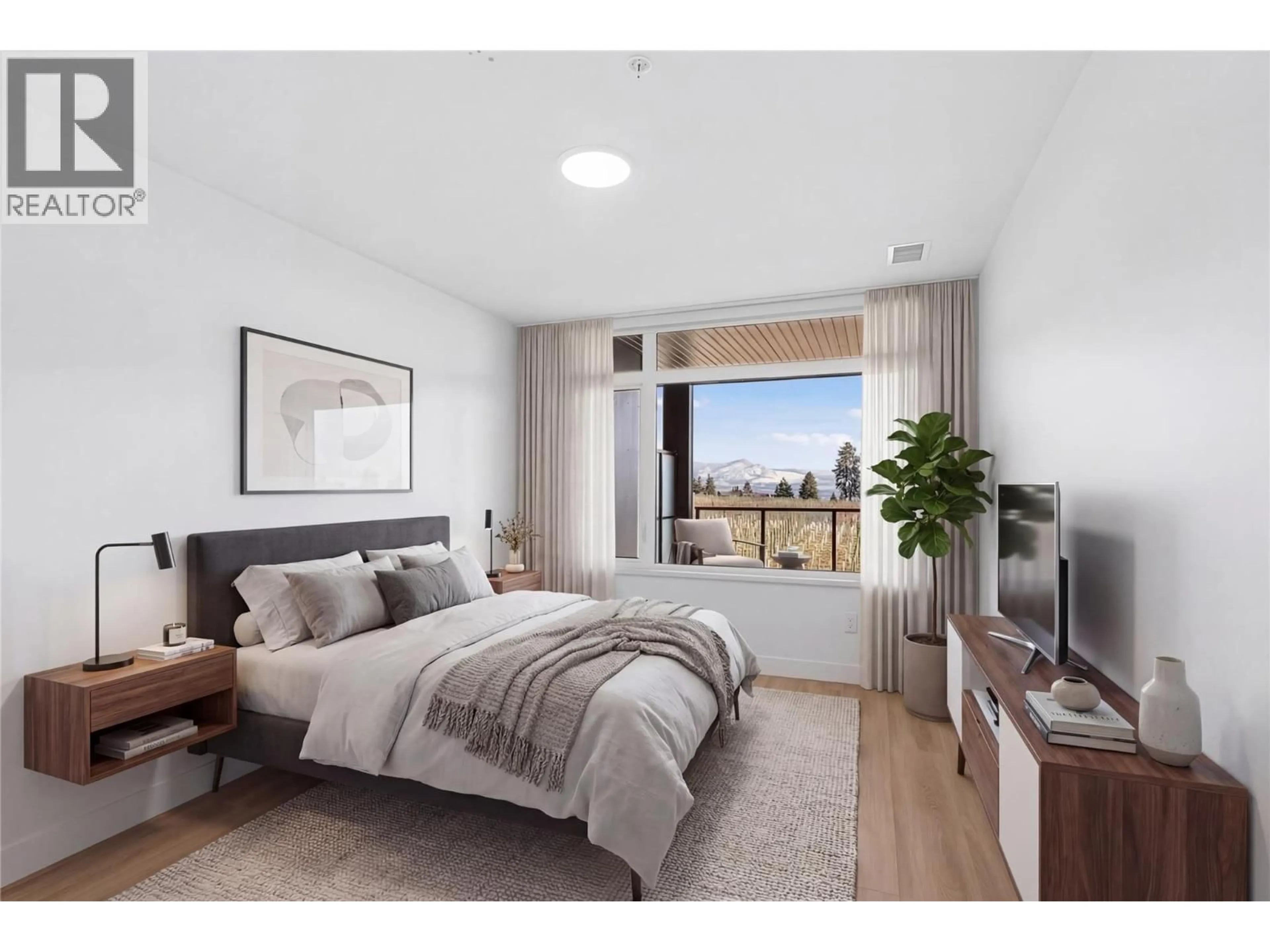 Bedroom with bed, wood/laminate floor for 209 - 2780 OLALLA ROAD, West Kelowna British Columbia V1Z2A9