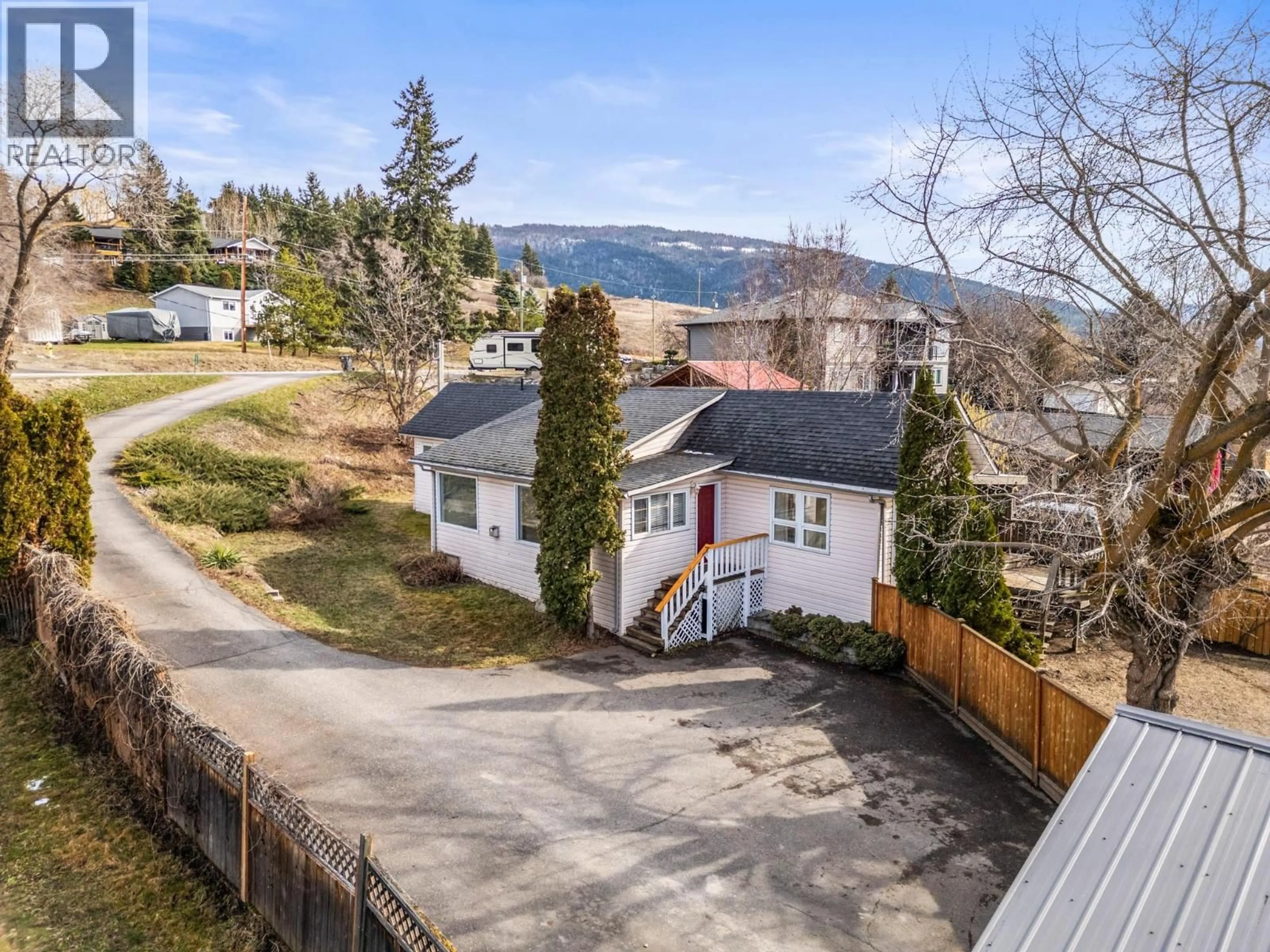 A pic from outside/outdoor area/front of a property/back of a property/a pic from drone, mountain view for 6670 L & A ROAD, Vernon British Columbia V1B3T1