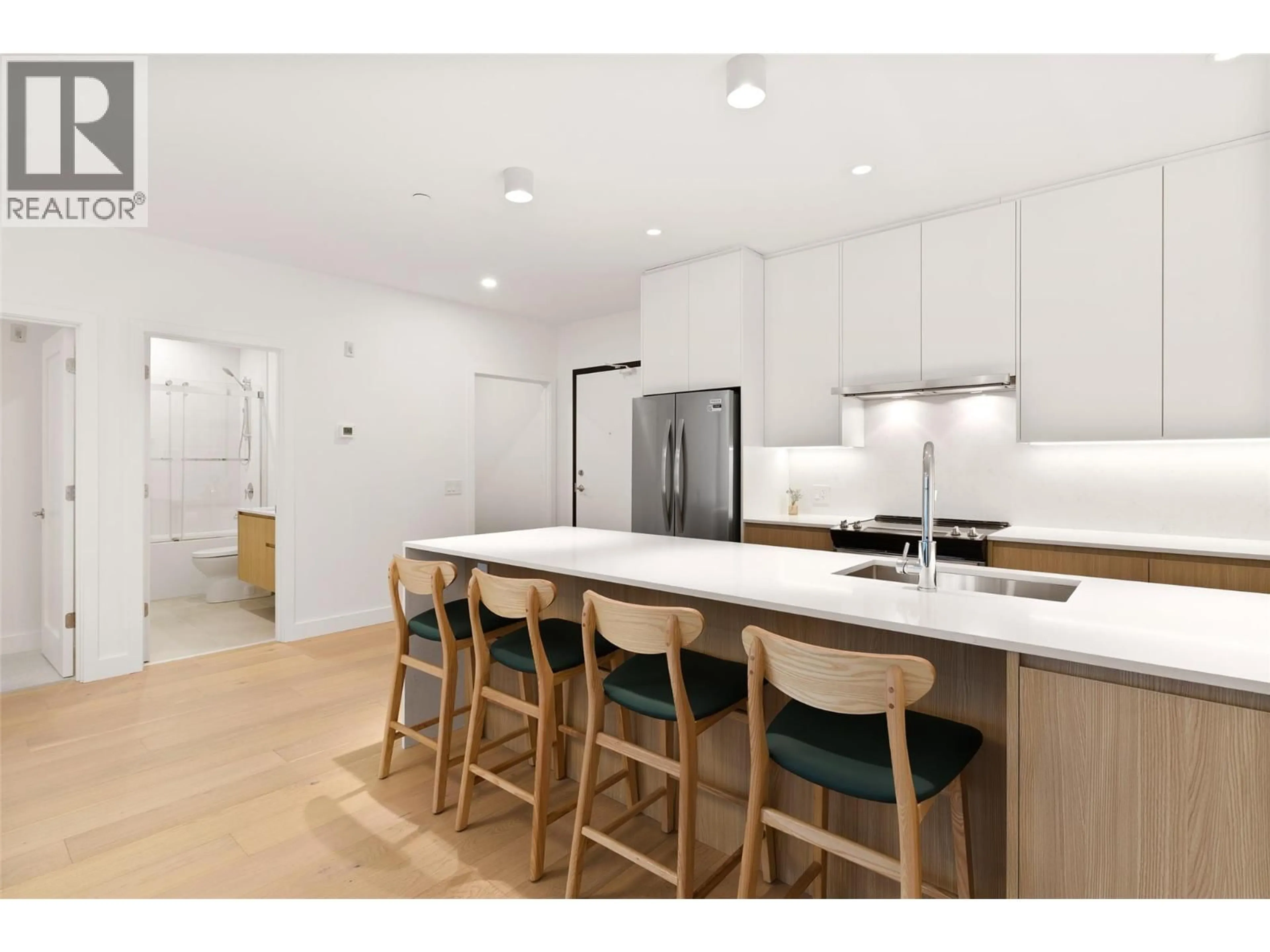 Open concept kitchen, wood/laminate floor for 2303 - 1702 COURSIER AVENUE, Revelstoke British Columbia V0E2S0