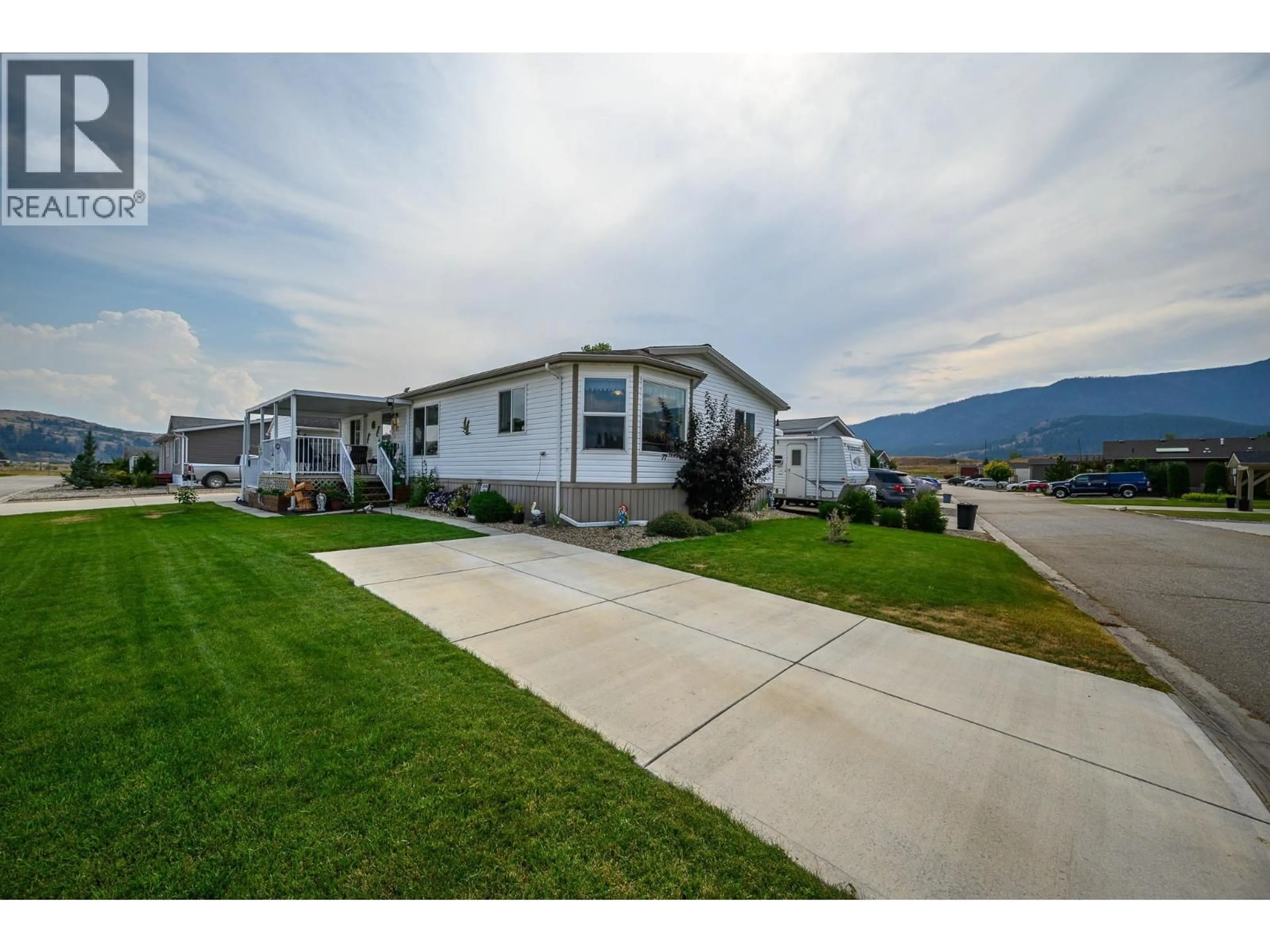Home with vinyl exterior material, mountain view for 77 - 12560 WESTSIDE ROAD, Vernon British Columbia V1H1S9