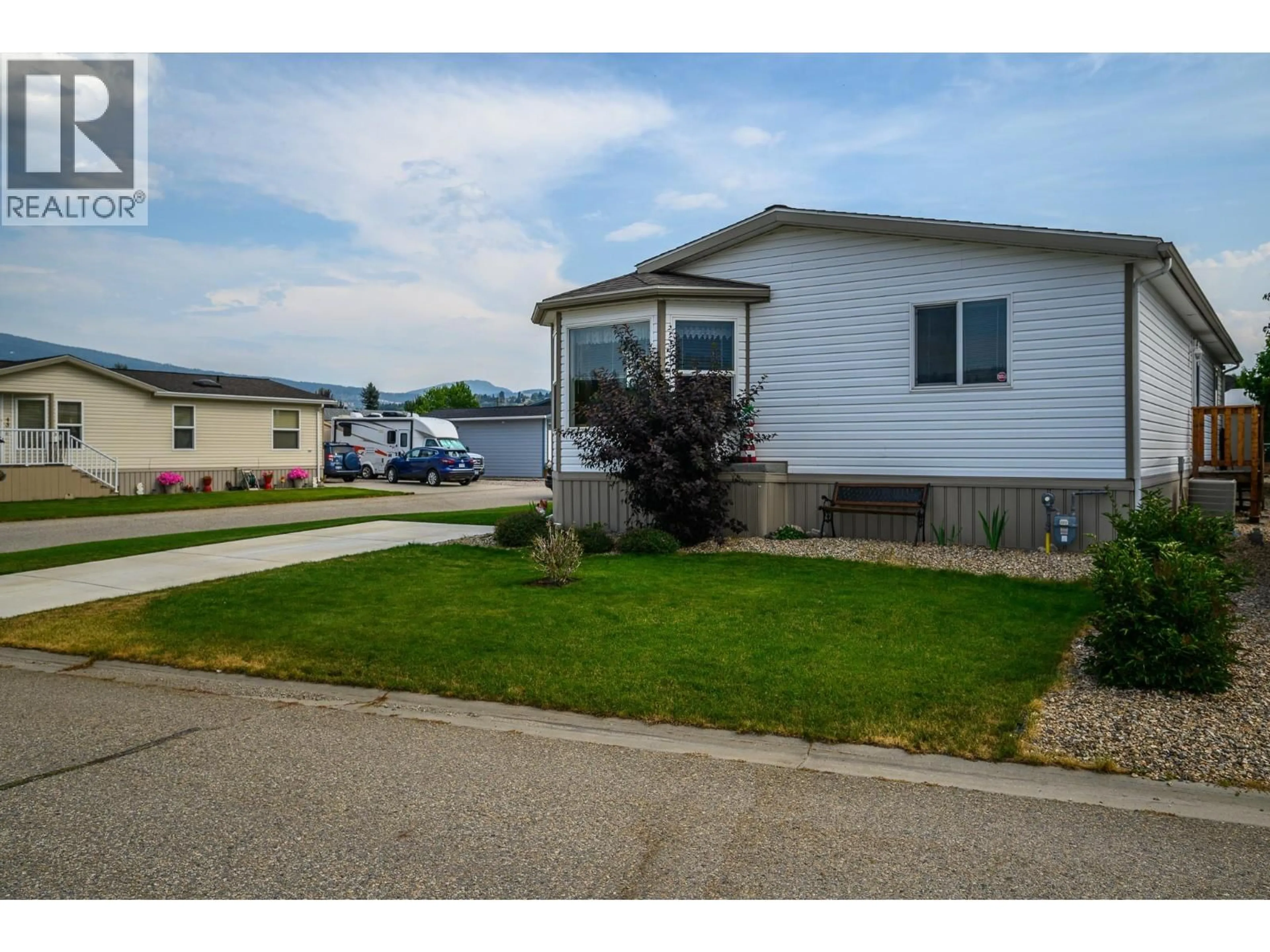 Home with vinyl exterior material, street for 77 - 12560 WESTSIDE ROAD, Vernon British Columbia V1H1S9