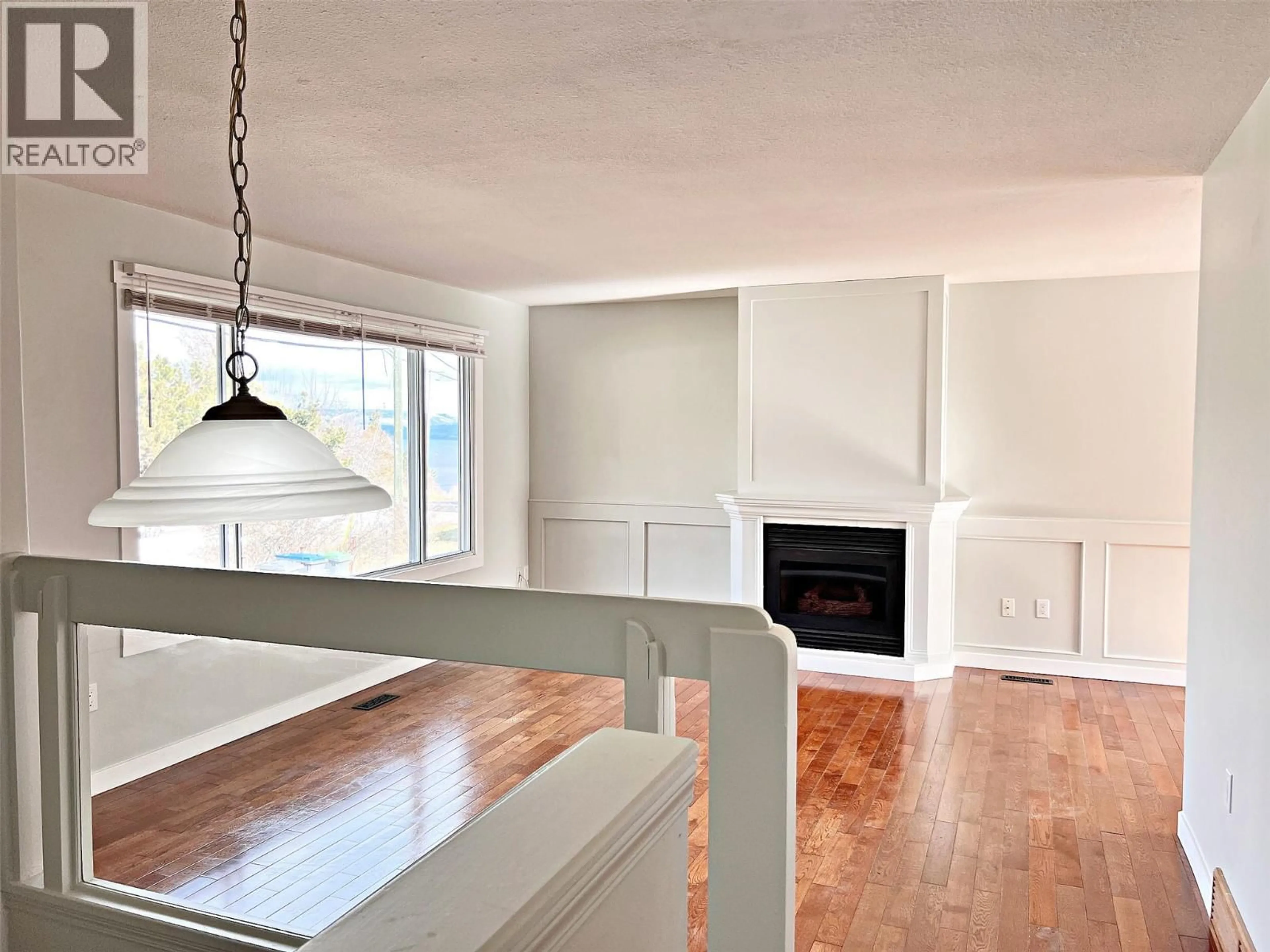 Open concept kitchen, wood/laminate floor for 4809 PRINCETON AVENUE, Peachland British Columbia V0H1X7