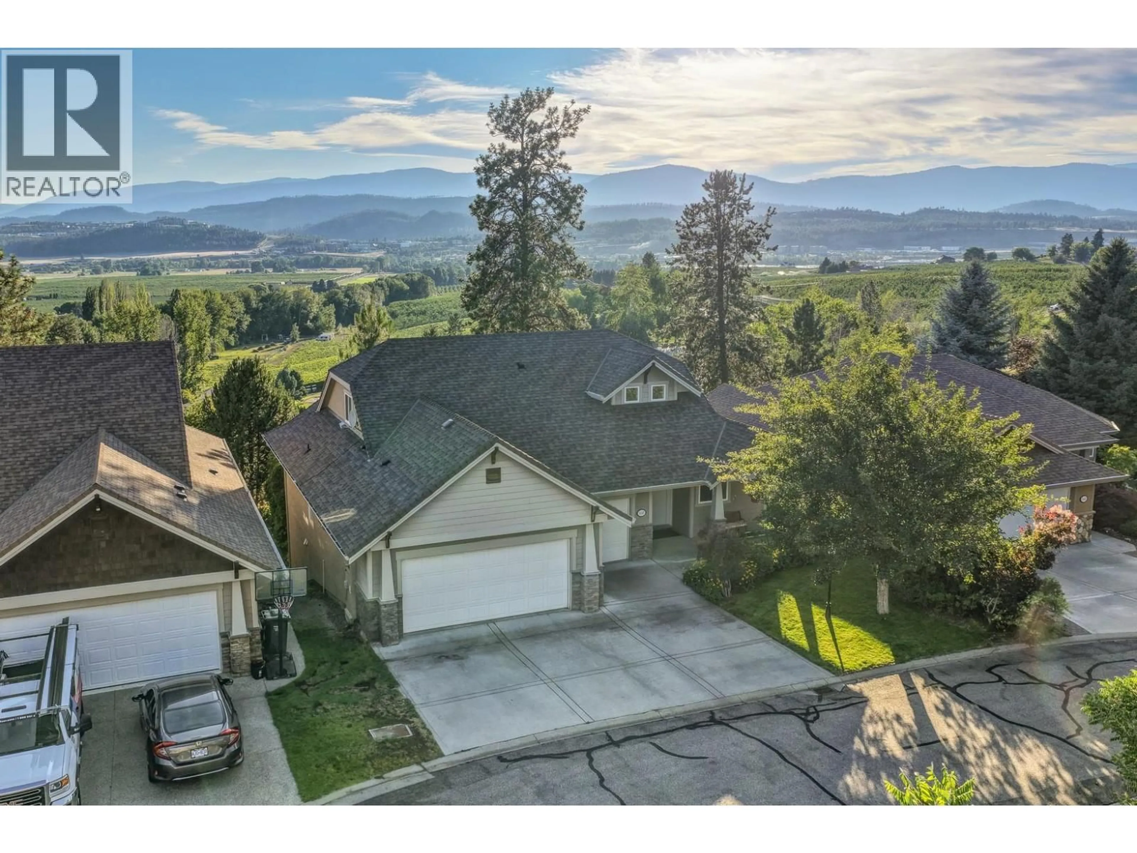 A pic from outside/outdoor area/front of a property/back of a property/a pic from drone, mountain view for 5147 SILVERADO PLACE, Kelowna British Columbia V1X7X8
