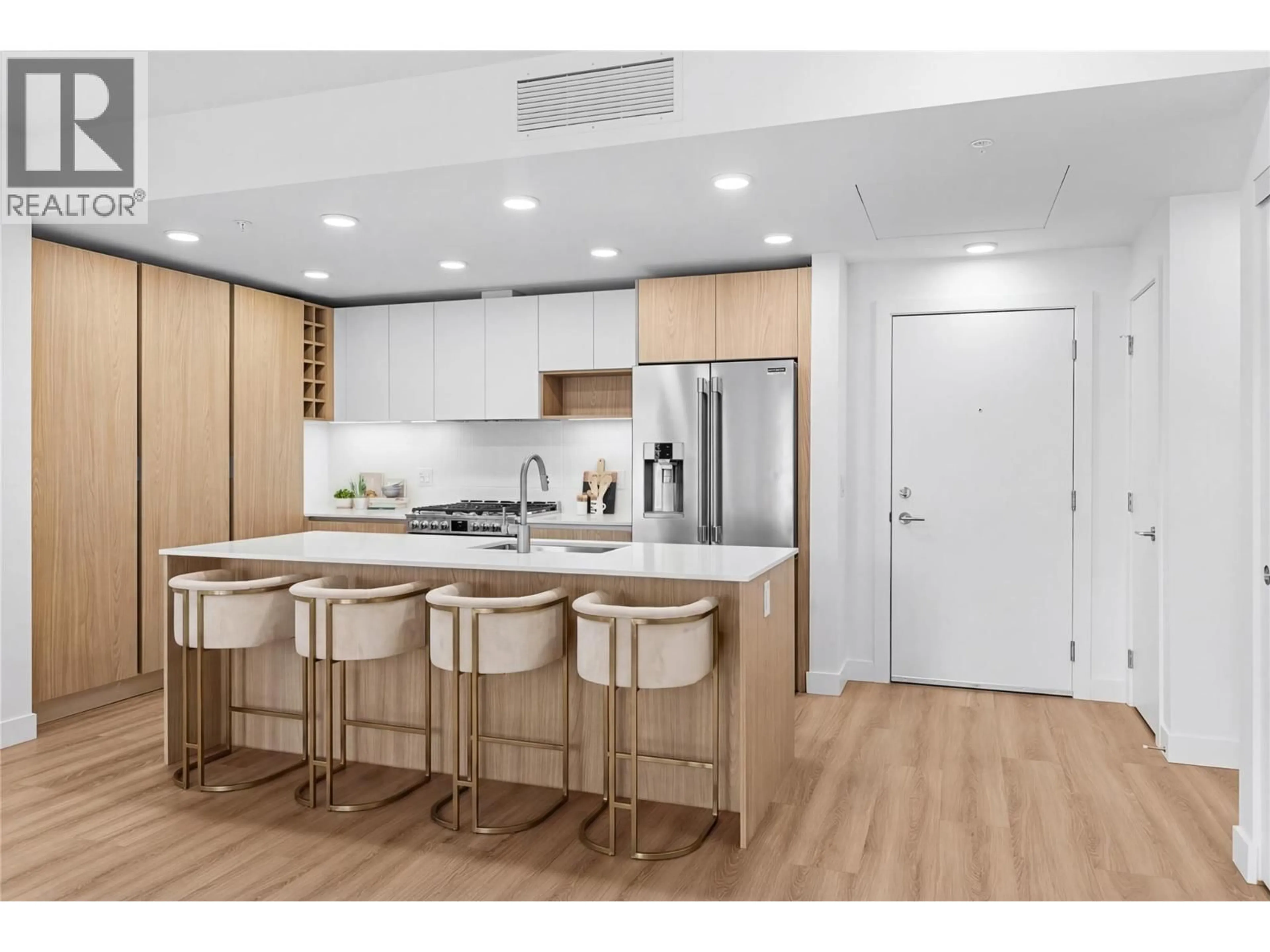 Open concept kitchen, wood/laminate floor for 301 - 2780 OLALLA ROAD, West Kelowna British Columbia V1Z2A9