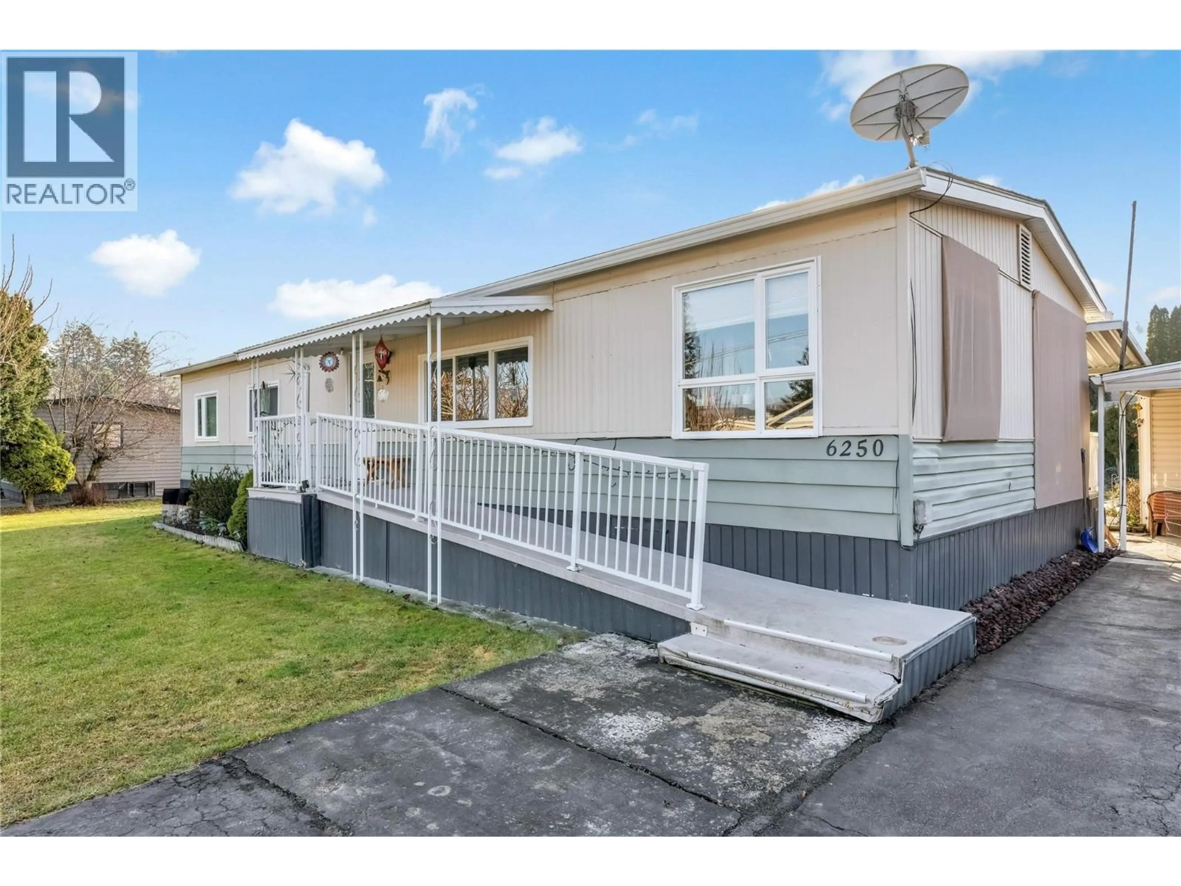 Home with vinyl exterior material, street for 6250 QUAIL ROAD, Vernon British Columbia V1H1M8