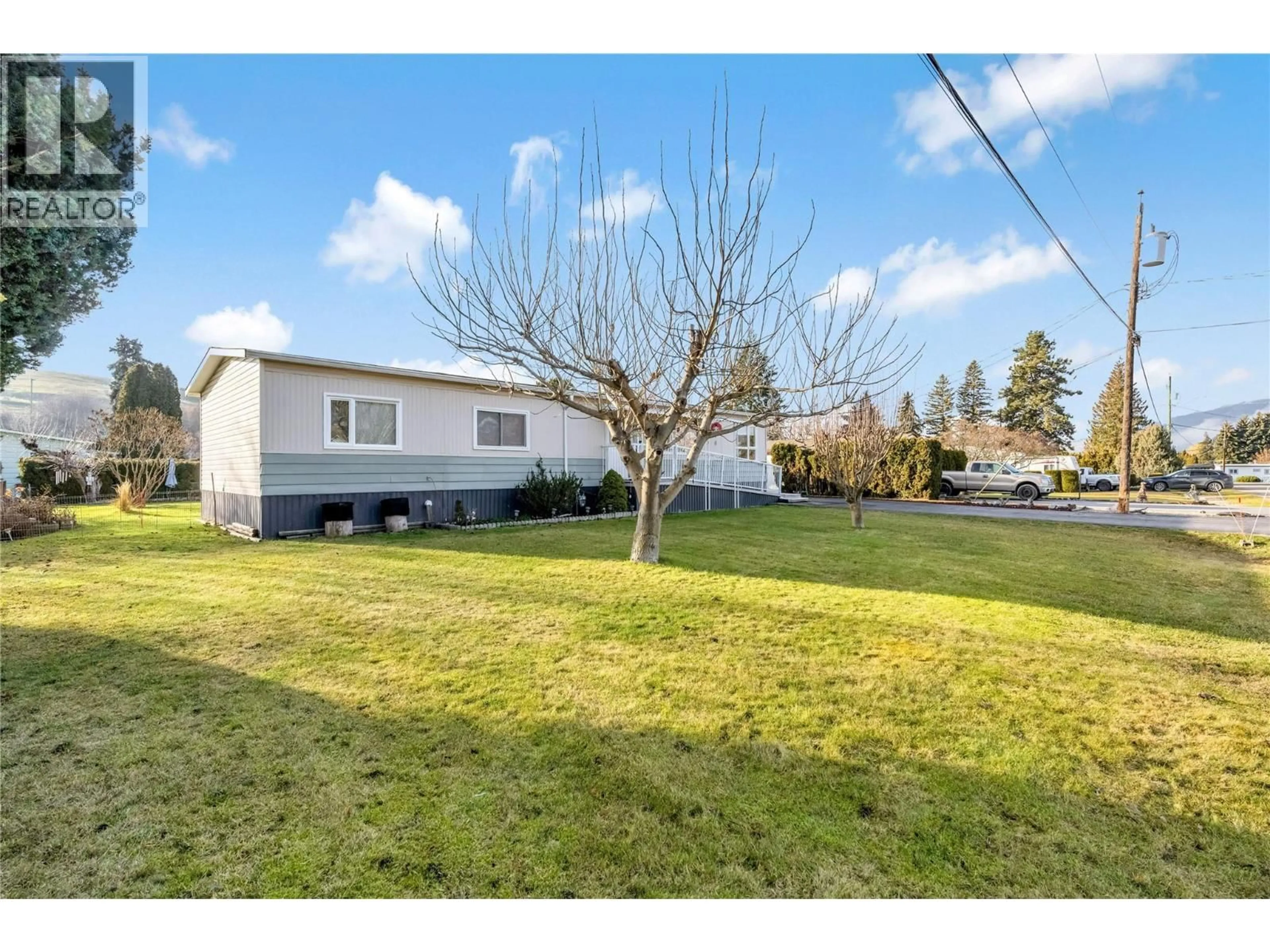 A pic from outside/outdoor area/front of a property/back of a property/a pic from drone, street for 6250 QUAIL ROAD, Vernon British Columbia V1H1M8
