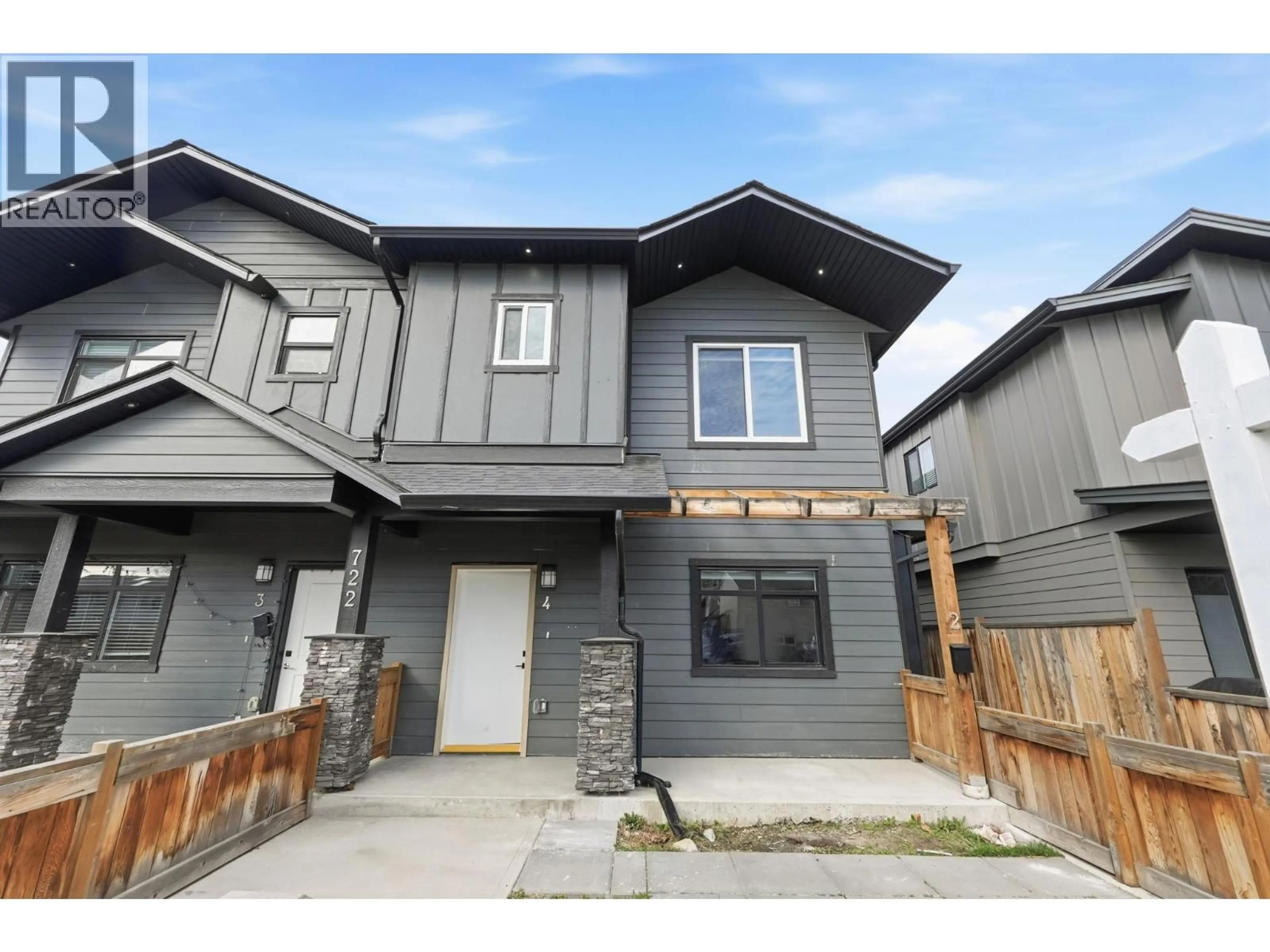 Home with vinyl exterior material, street for 4 - 722 COOPLAND CRESCENT, Kelowna British Columbia V1Y2V1