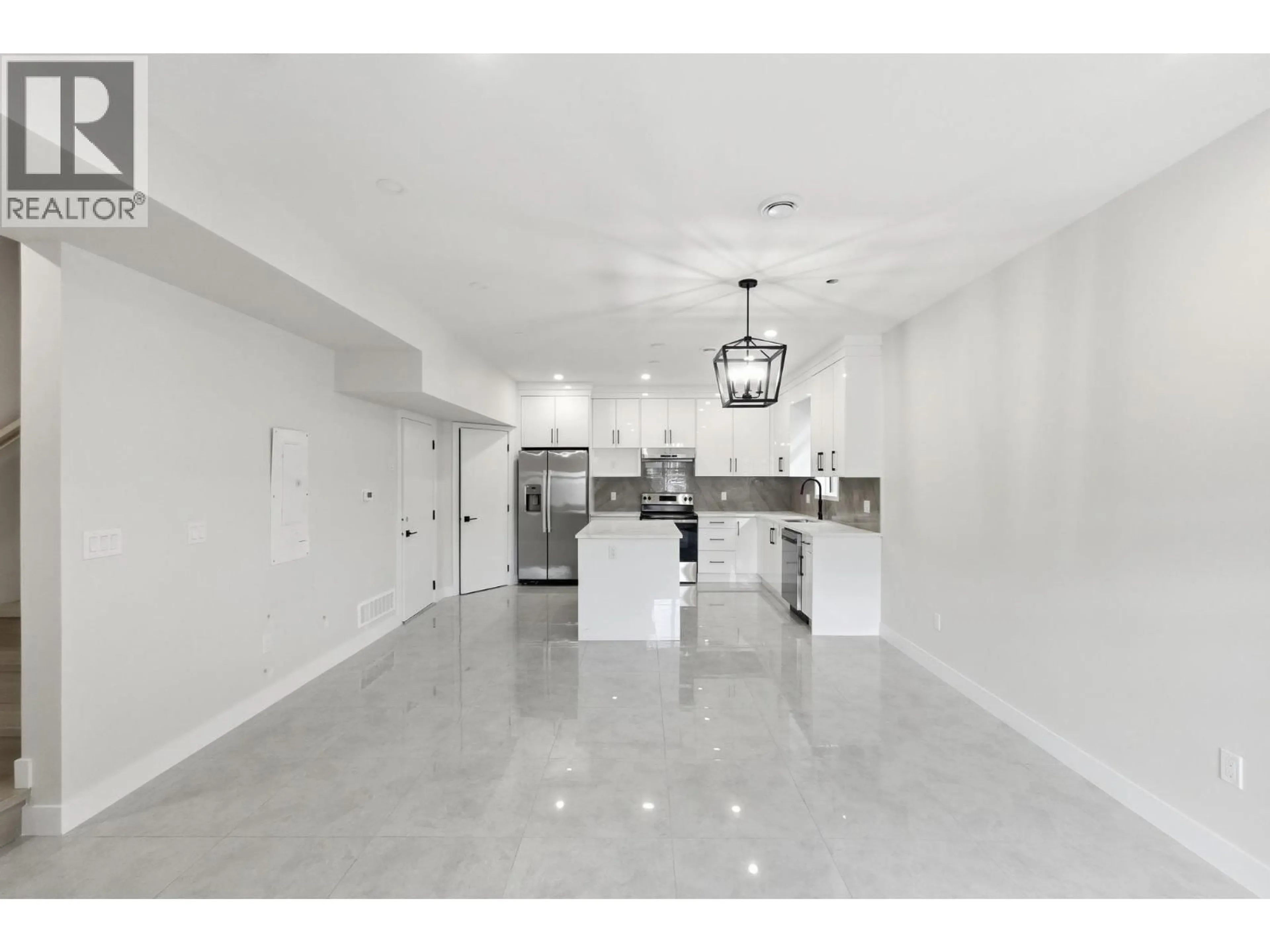 Open concept kitchen, ceramic/tile floor for 4 - 722 COOPLAND CRESCENT, Kelowna British Columbia V1Y2V1